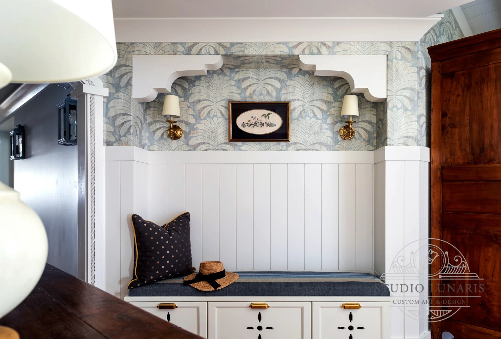 Hallway wall design with a palm frond theme stencil pattern.