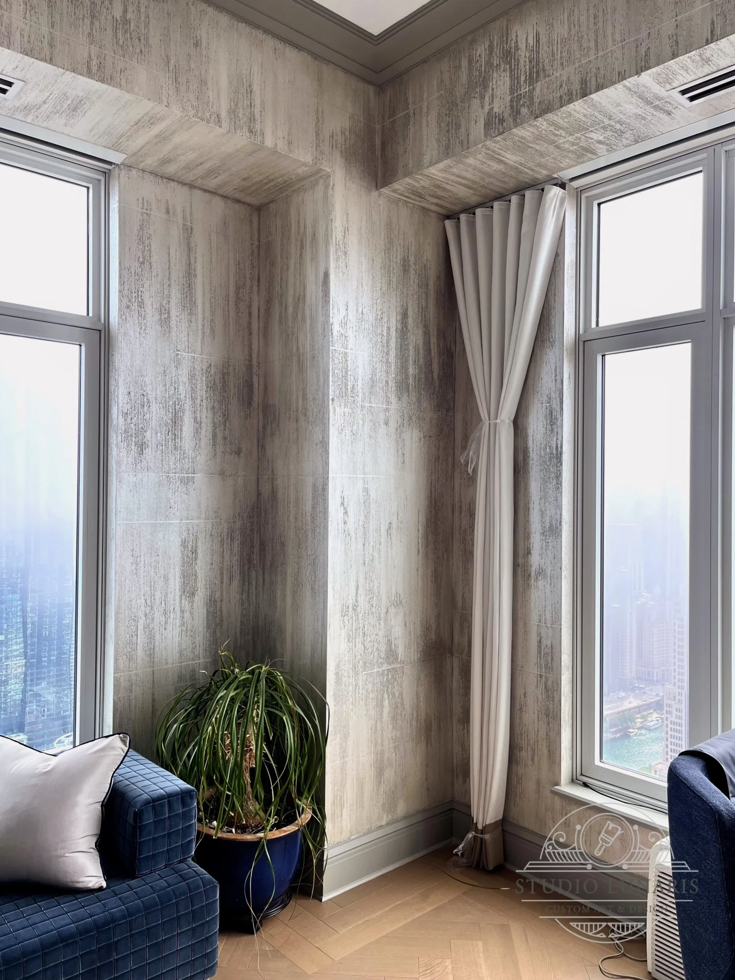 Living room walls with striated, textured beads in distressed warm grey color