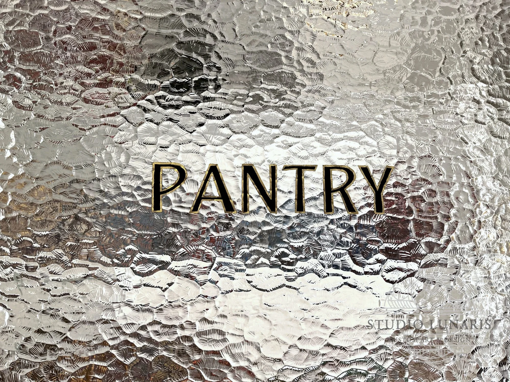 Painted lettering on pantry glass door with metallic gold leaf accents