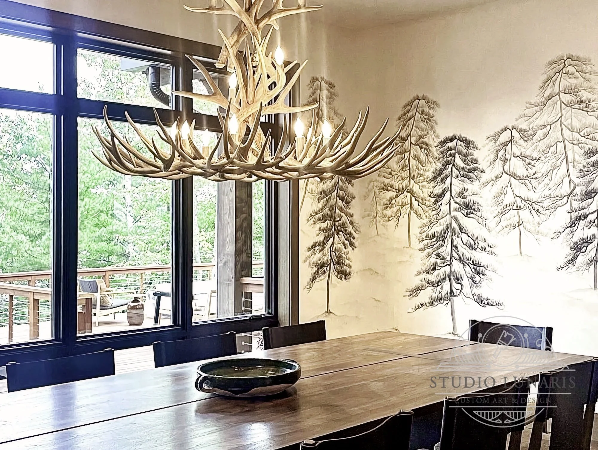 Lake house dining room mural with a chinoiserie inspired pine tree theme