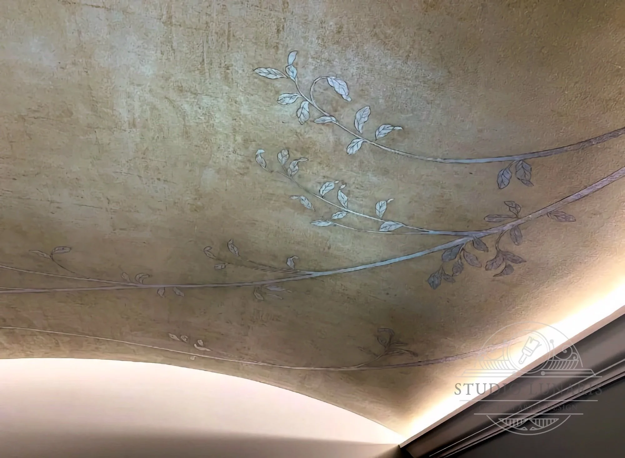 Vaulted bedroom ceiling mural with a faux inlay silver vine design on a warm silver patina background