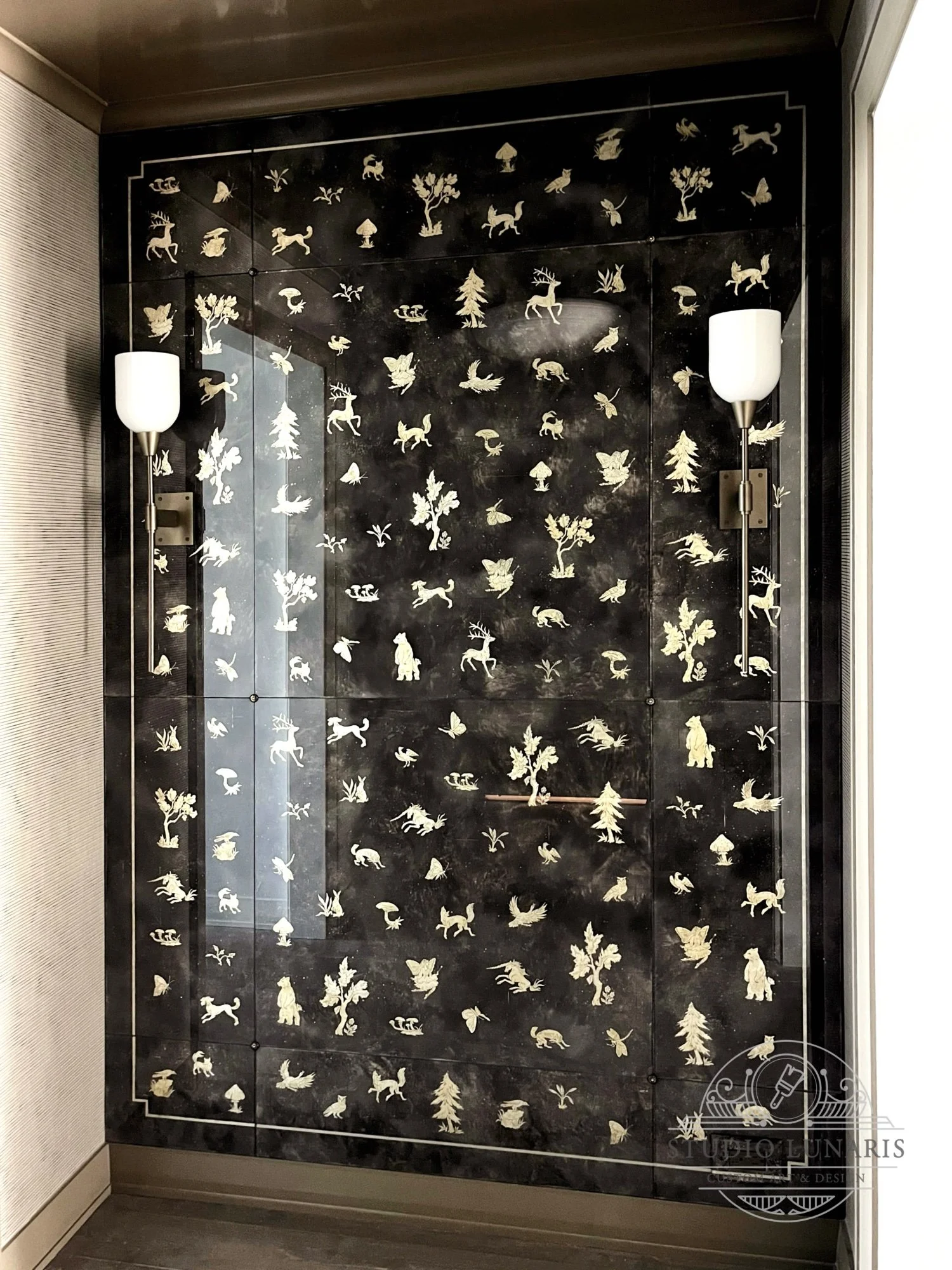 Entry foyer verre églomisé painted glass wall panels with a forest themed silver accent elements - trees, plants, animals and insects