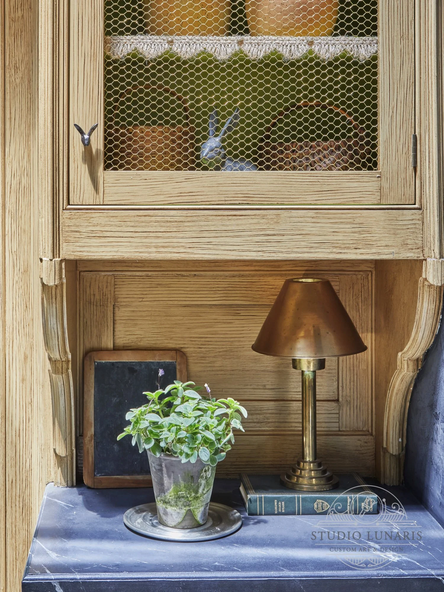Faux painted wood on potting room cabinets 