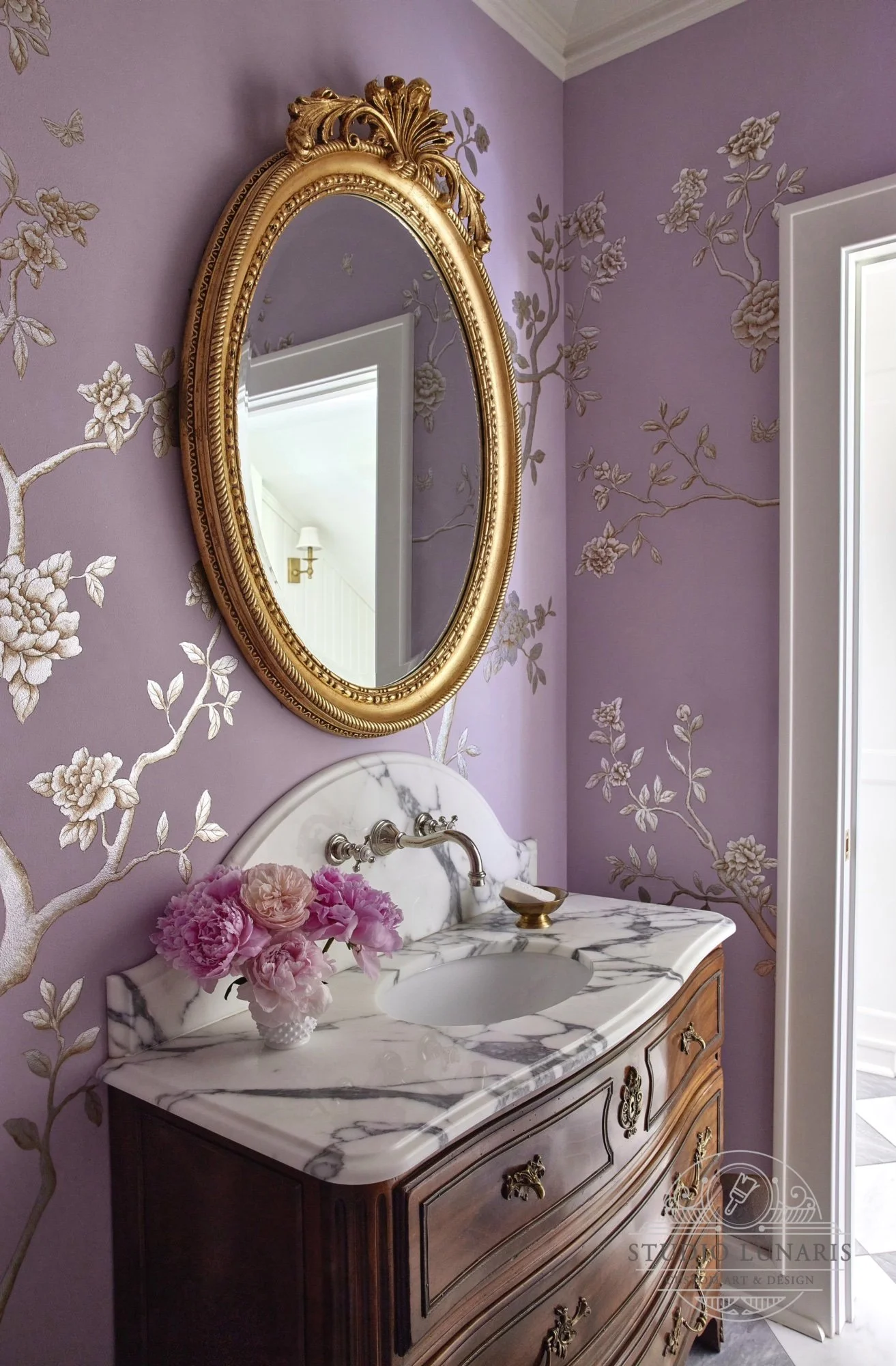 Powder room mural with a chinoiserie theme on a lavender background with floral silver accents
