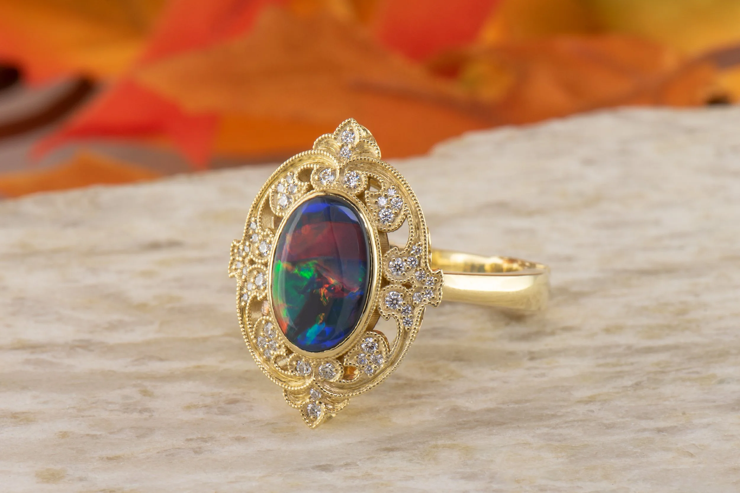 001-200-00182_DRJ9018_Yellow-Gold-Oval-Australian-Black-Opal-with-Scroll-and-Diamond-Halo-and-Euro-Shank_01-no- (1).jpg
