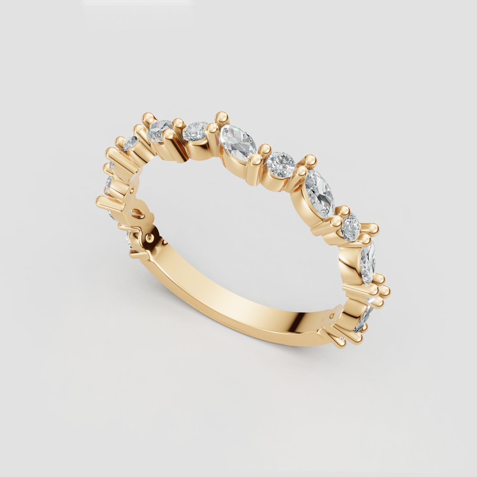 Gold ring with multiple clear gemstones, arranged in a continuous band.