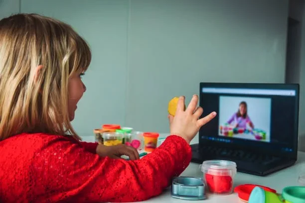 Child playing with playdoh during virtual Speech Language Therapy at Little Ears, Big Voices in Orange County, CA.