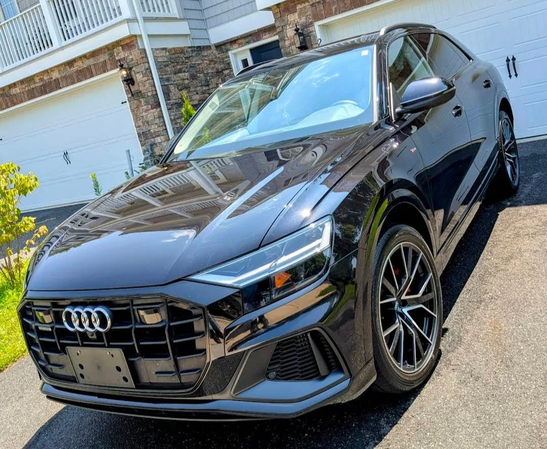 Professional mobile detailing - black Audi with Elite Exterior Ceramic Coating high-gloss finish.