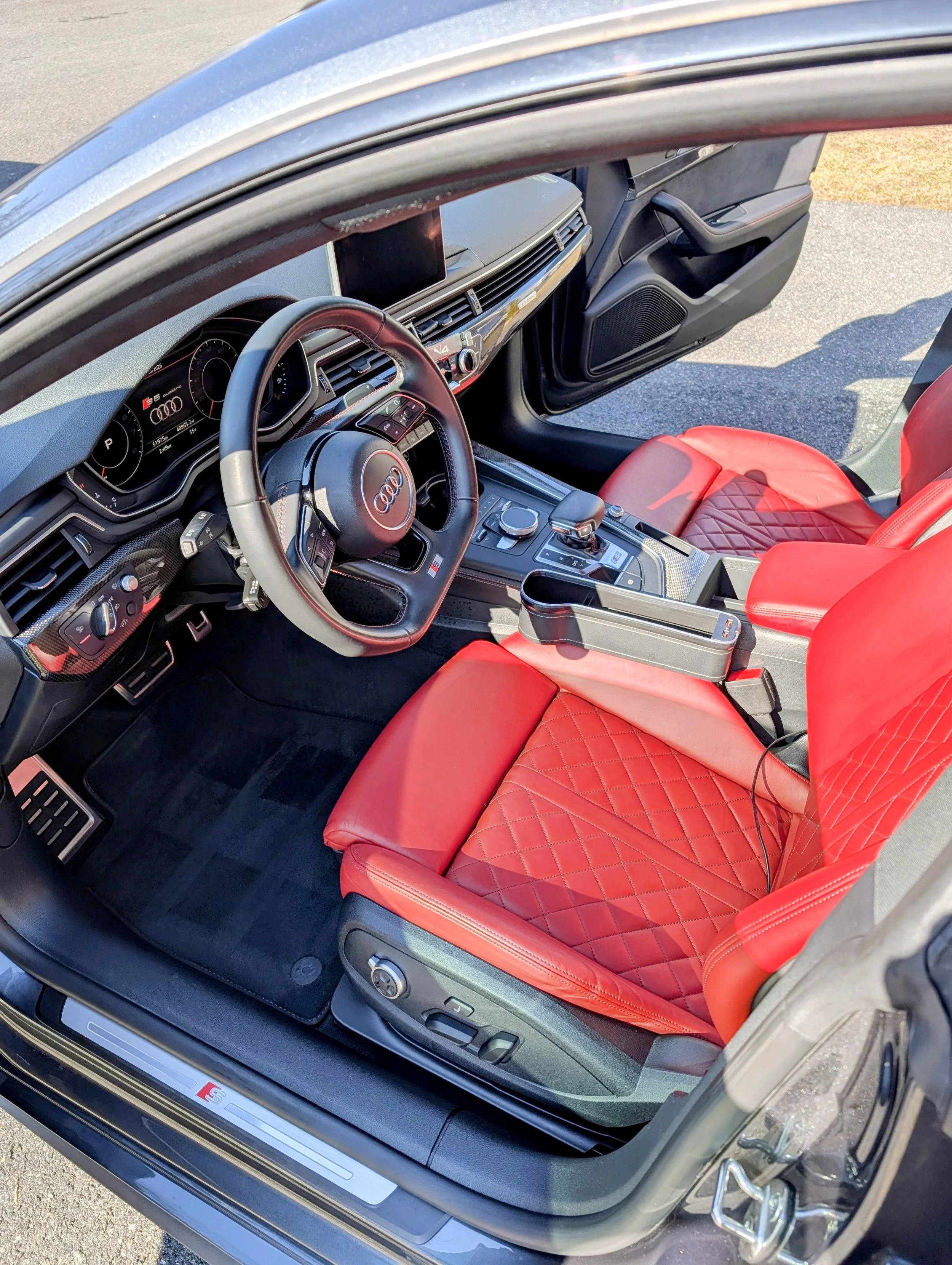 Bold Interior Restoration. This deep-cleaning and conditioning service brought the vibrancy back to these premium red leather seats. Our detailed 4-hour process ensures every inch of the cabin--from the steering wheel to the floor mats--is revitalize