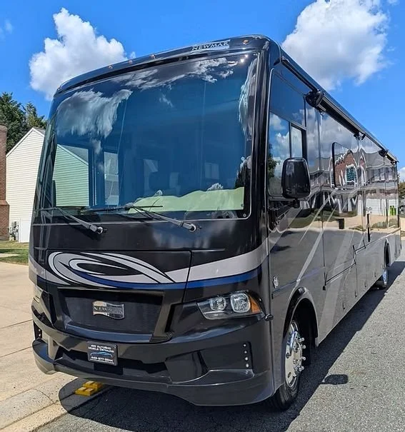 Showcasing the mirror-like finish on this premium Newmar motorhome. Our Fleet & Oversized Vehicle services are tailored to the unique needs of luxury RVs, utilizing industrial-strength decontamination and high-gloss protection to maintain a showroom 