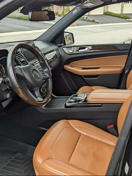 Professional mobile detailing in Maryland - Ozone generator machine inside a vehicle interior for deep odor elimination.