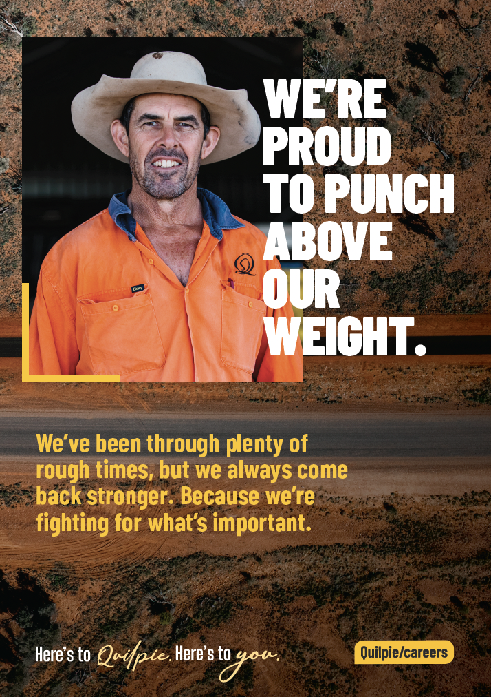 A man wearing an orange work shirt and a large white hat standing in front of a dirt ground with text overlay that reads, 'We're proud to punch above our weight.' The lower text states, 'We've been through plenty of rough times, but we always come back stronger. Because we're fighting for what's important.' There is small text at the bottom that says, 'Here's to Quilpie. Here's to you.' and a yellow label that says 'Quilpie/careers'.