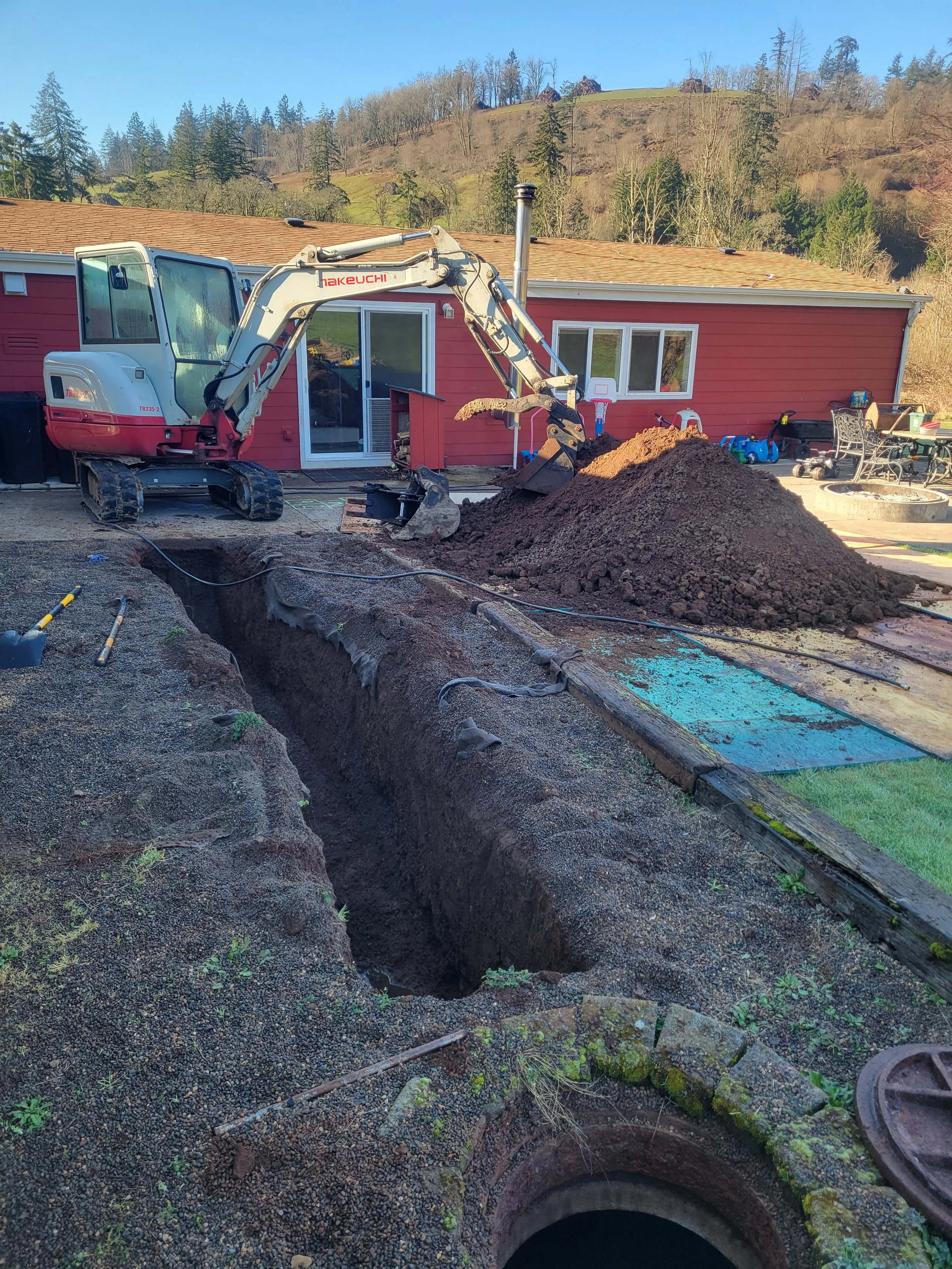 Action Jackson Excavation at work trenching for a septic line in Turner Oregon.