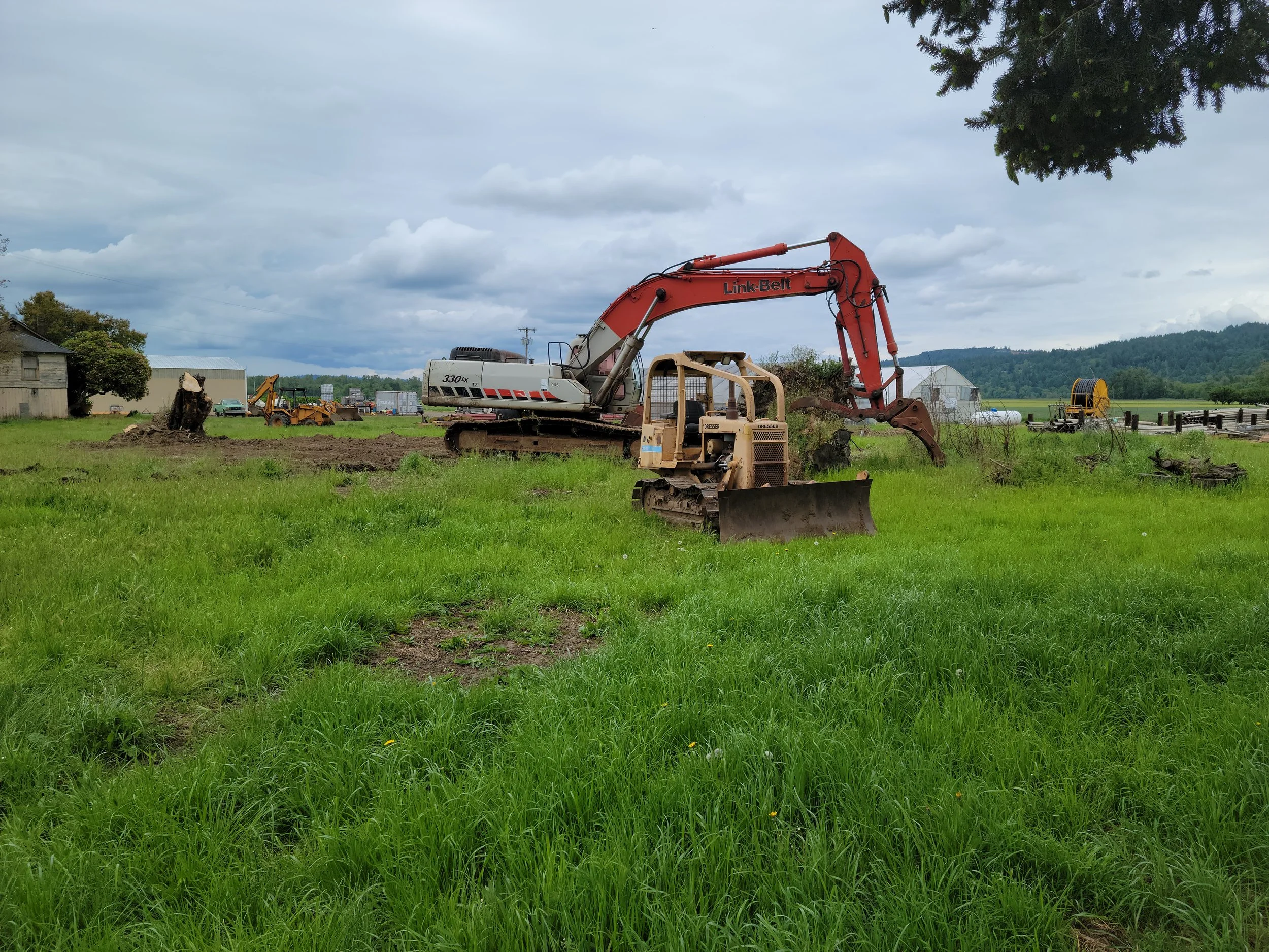 Dozer ad excavator in field Independence Oregon