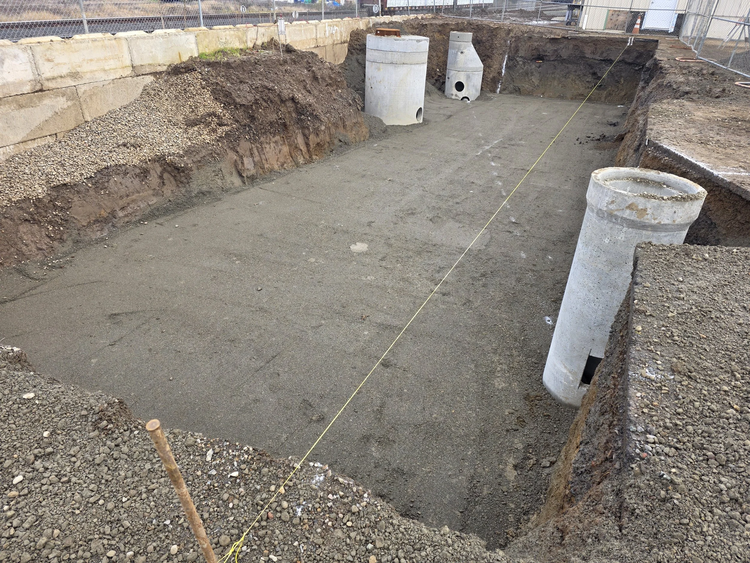 Water detention pond for storage unit facility Salem Oregon catch basin construction
