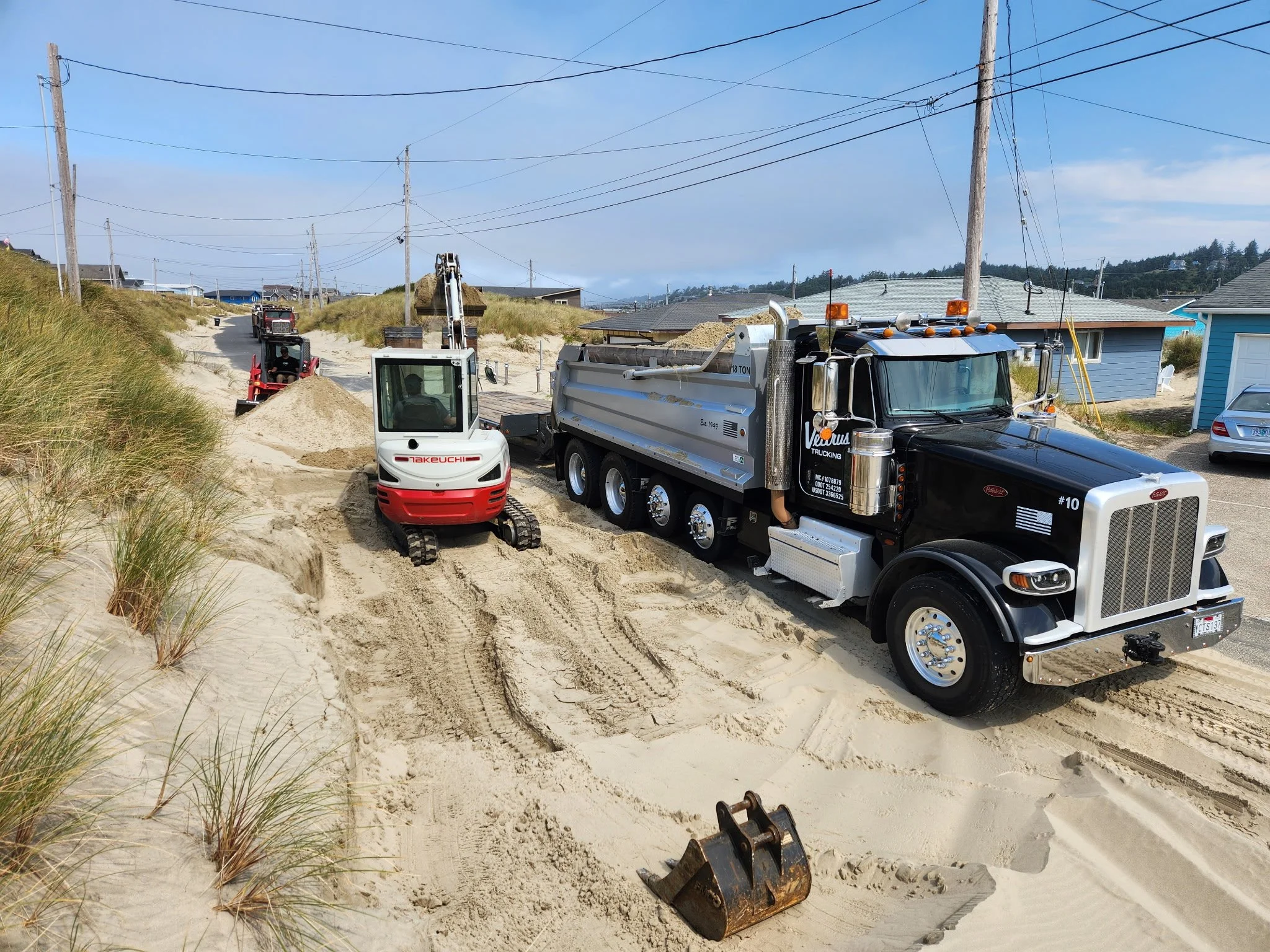 Removing Sand in Newport Oregon.