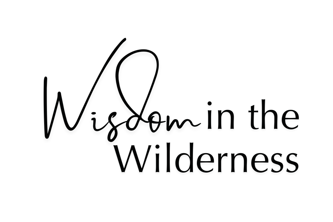 Decorative text that says 'Wisdom in the Wilderness' with a stylized feather graphic.