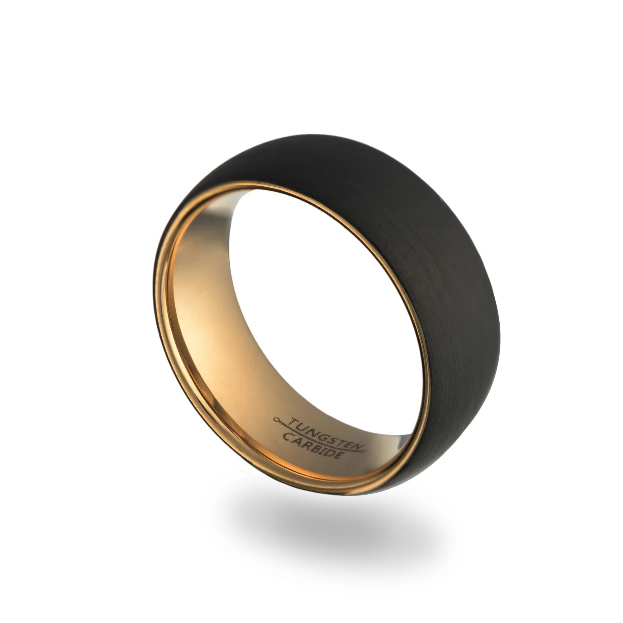 Close-up of a black tungsten carbide ring with a gold inner band.