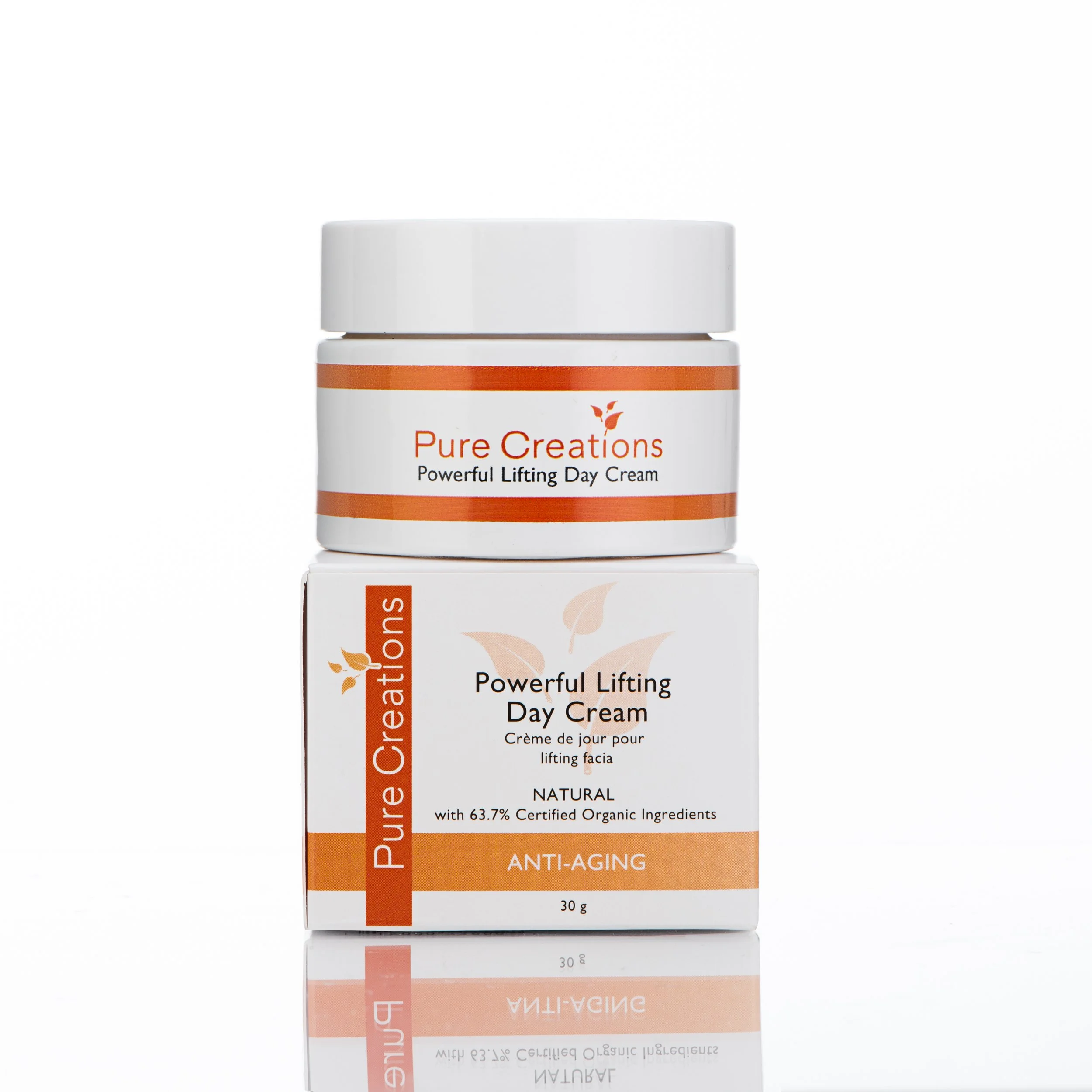 A white jar of Pure Creations Powerful Lifting Day Cream with orange accents, placed on top of its matching white box with orange and black text, against a white background.
