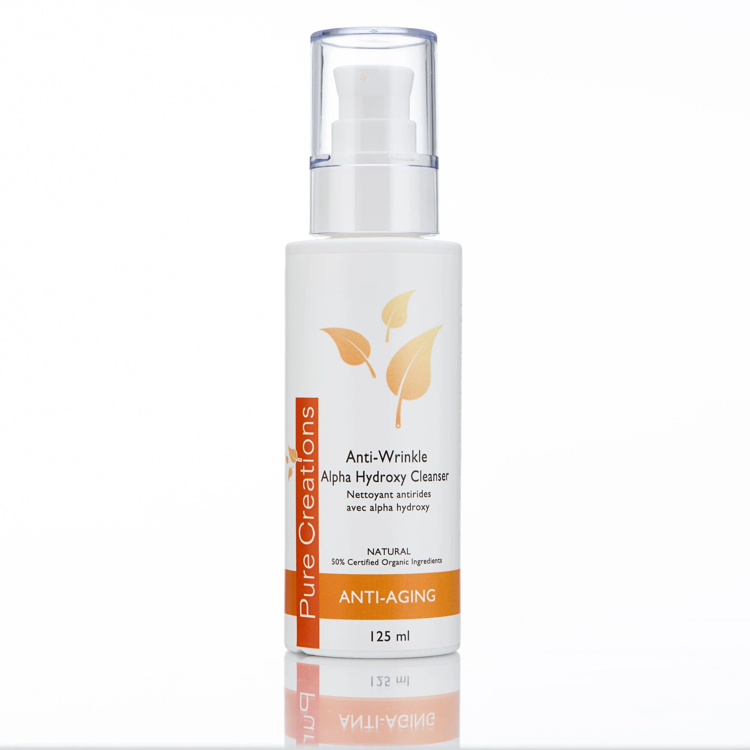 A white bottle with a pump dispenser of anti-wrinkle alpha hydroxy cleanser, featuring a label with orange and black text, and a graphic of three orange leaves.