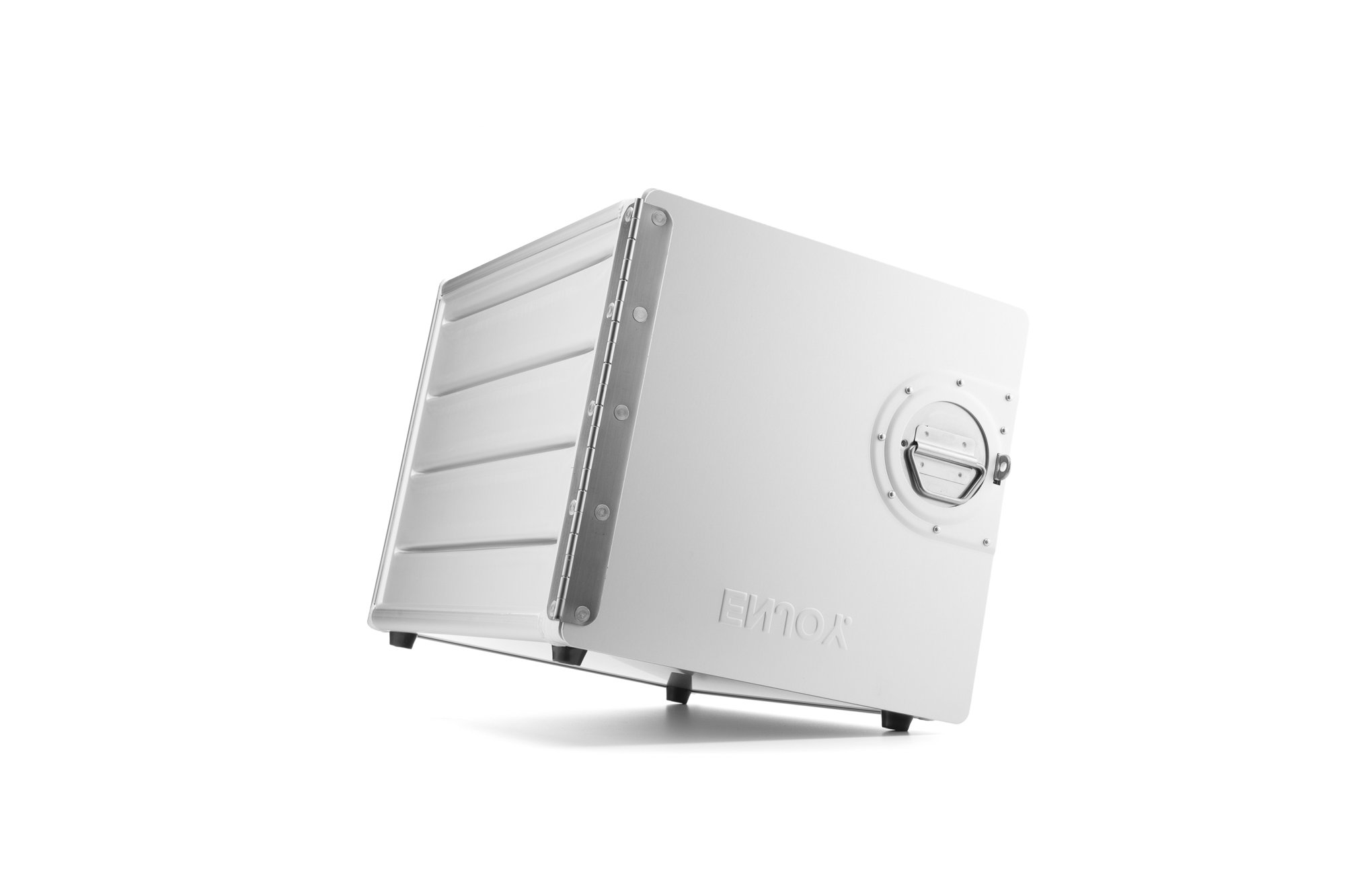 A white, modern ice maker with a front door, side handle, and adjustable legs, branded with the name "EVOX."