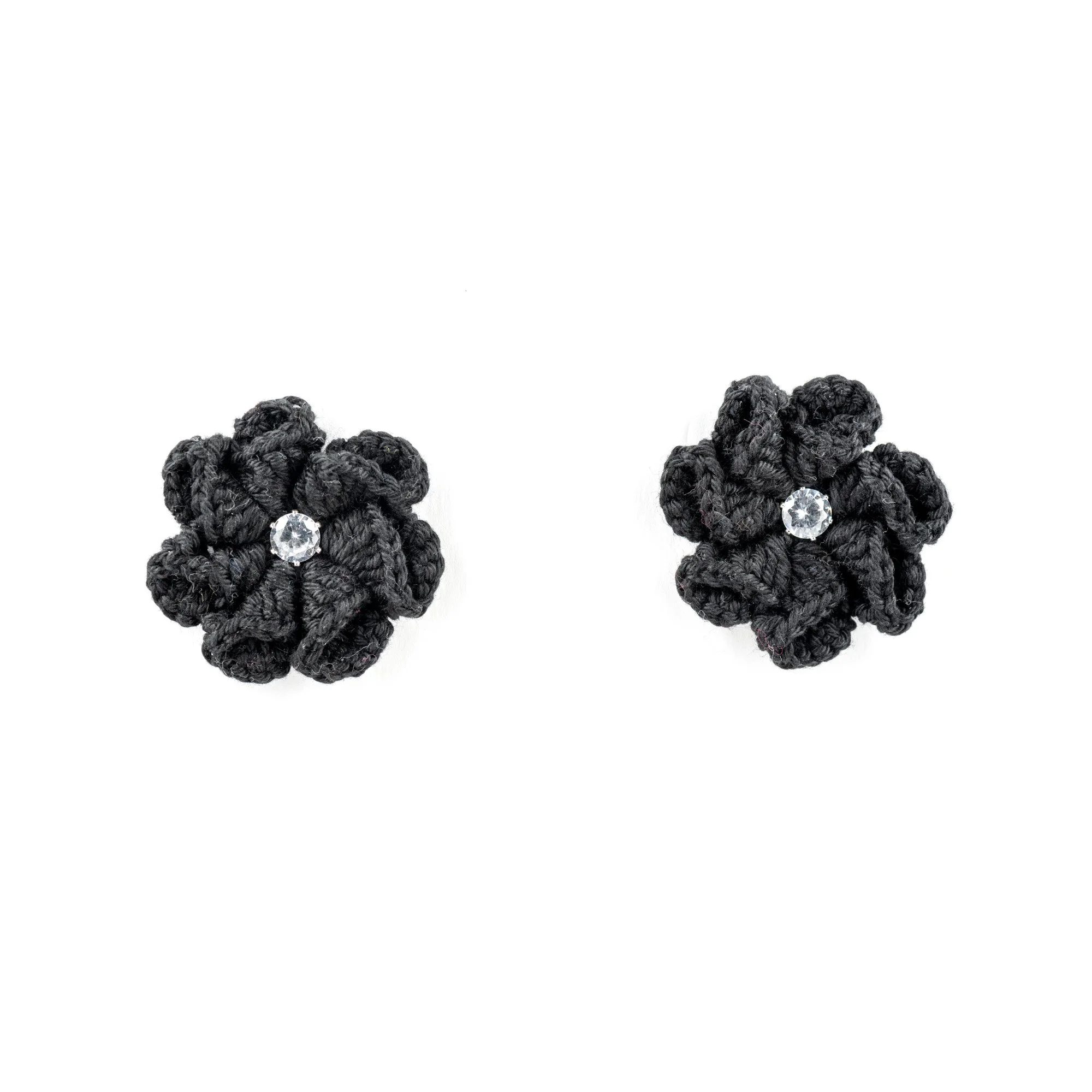 Pair of black knot earrings with a clear gemstone at the center, displayed on a plain white background.