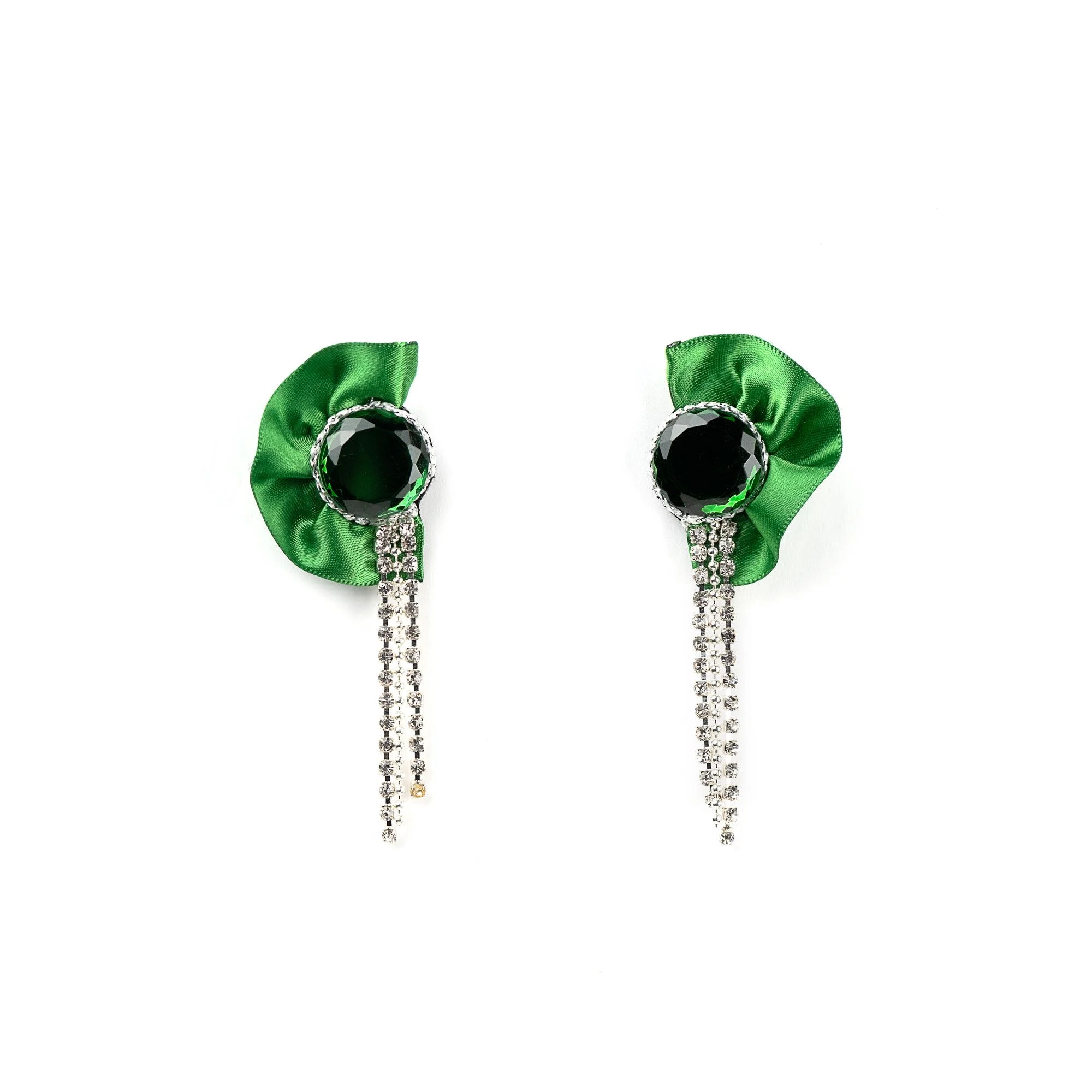Pair of earrings with green satin bows, black gemstones, and hanging rhinestone chains on a white background.