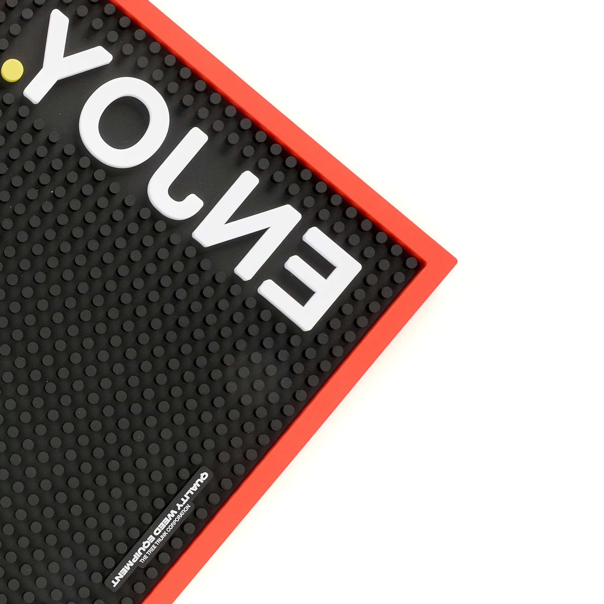 Close-up of a black digital scoreboard with white block letters spelling 'YOUTH' and a red border, featuring small raised dots on its surface.