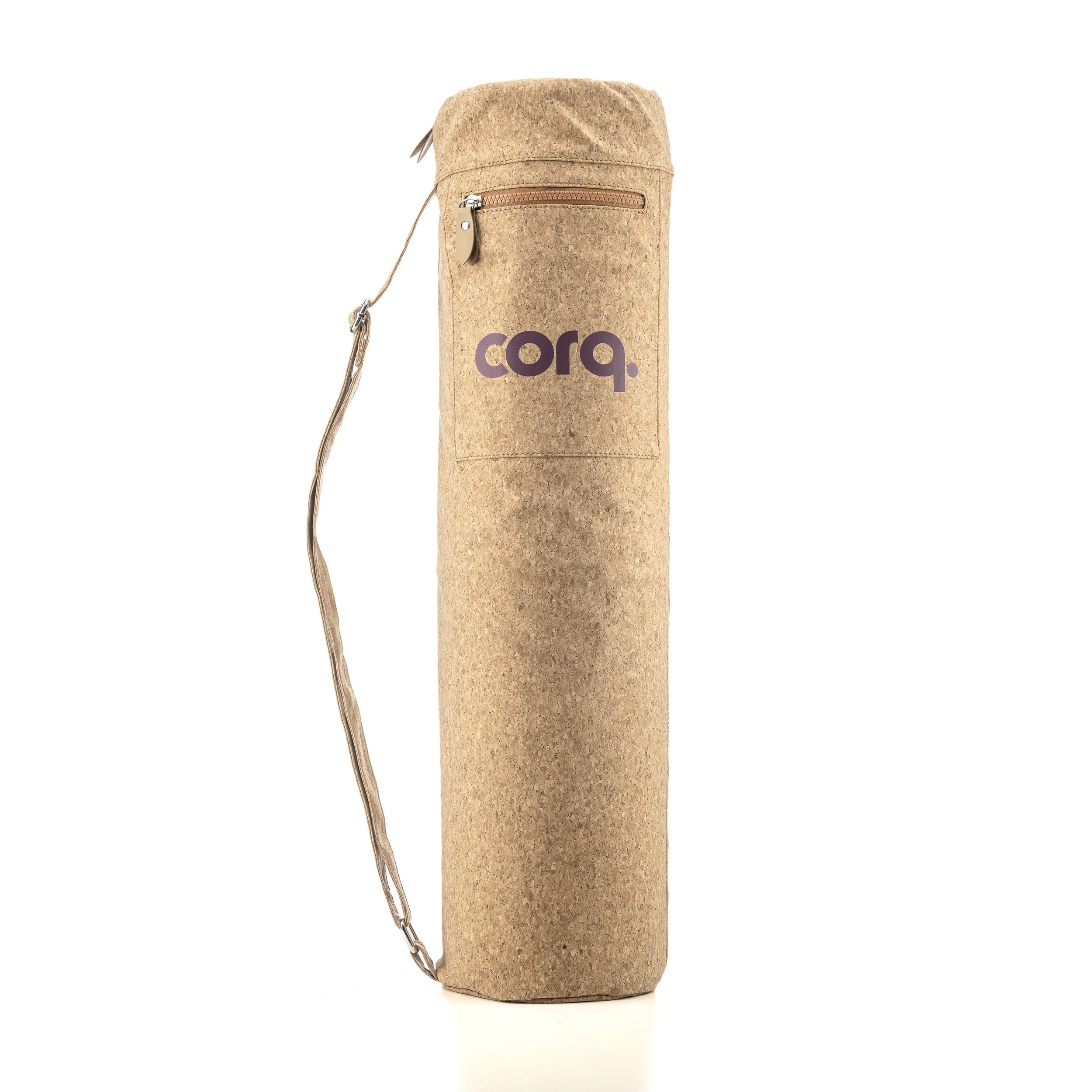 Cream-colored yoga mat bag with a brown logo that says 'corq.' and a shoulder strap, standing upright on a white background.