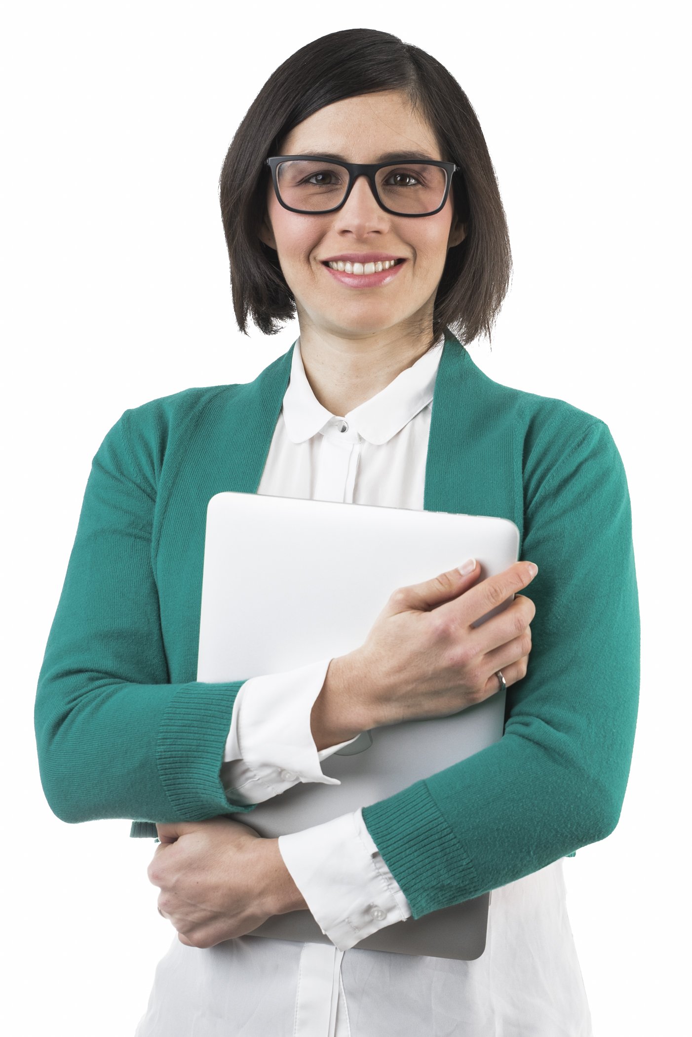 A confident woman with short dark hair and glasses, wearing a white blouse and teal cardigan, holding a closed silver laptop, smiling at the camera.