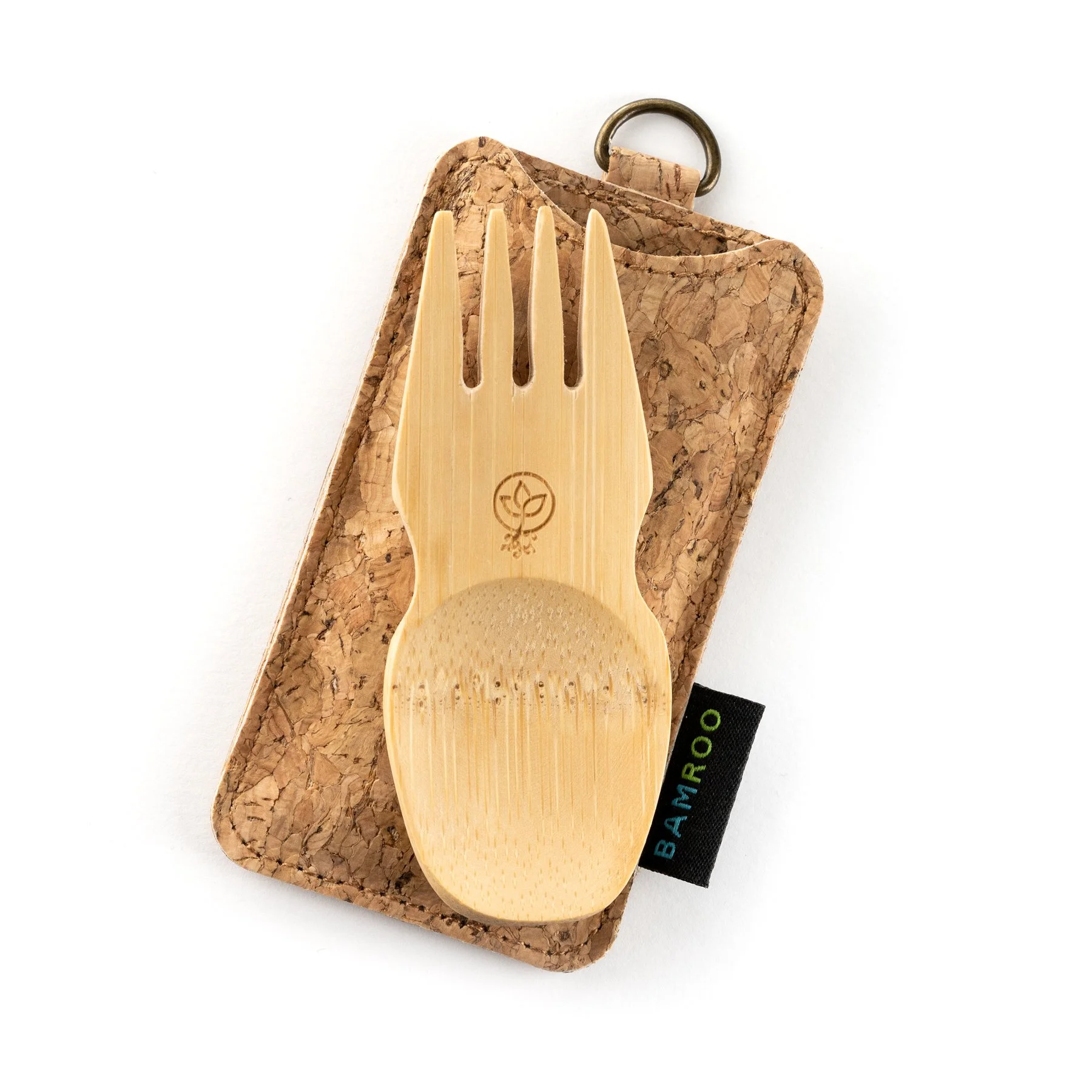 Bamboo utensil known as a fruit and vegetable picker, placed on a corked wooden board.