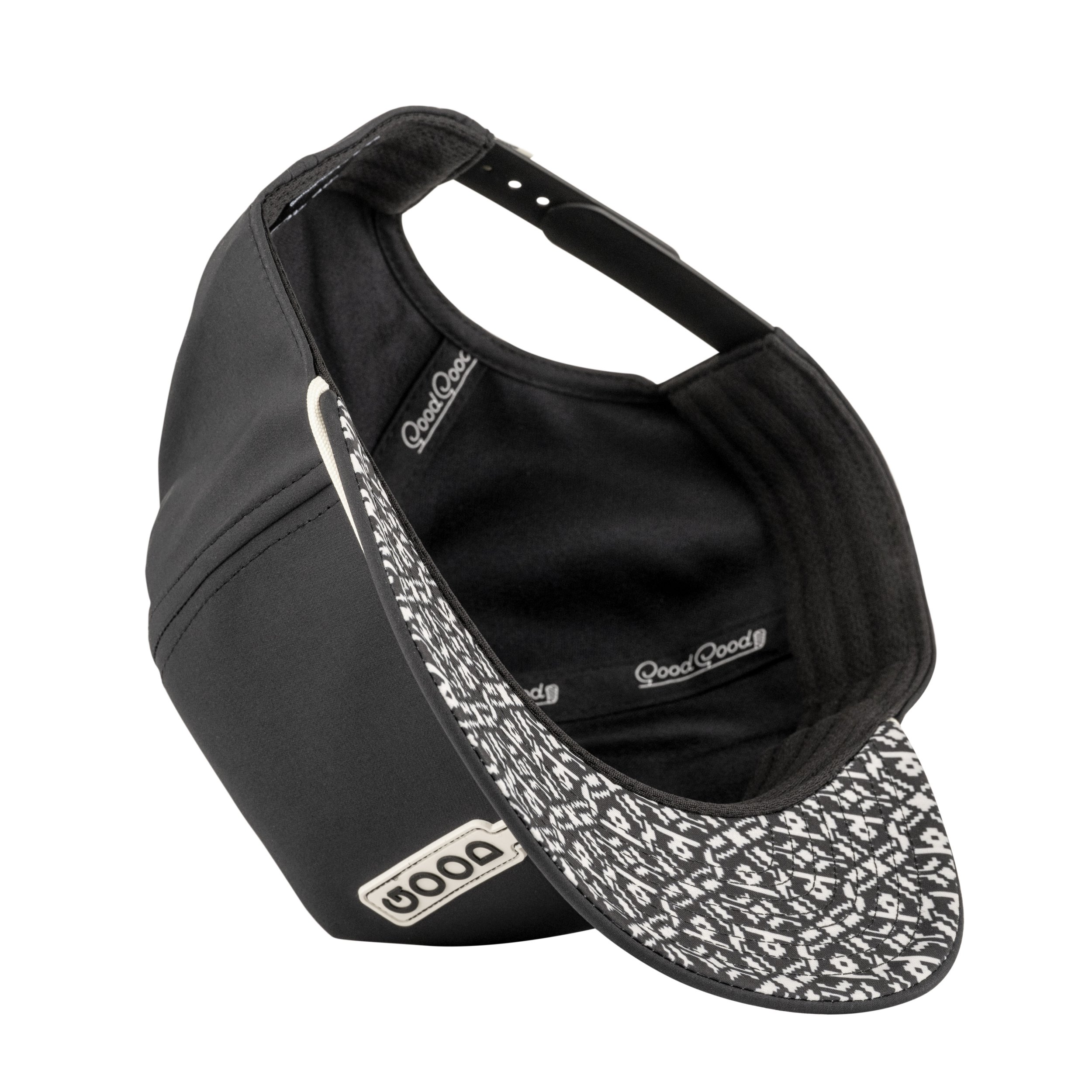 A black and white patterned Dood golf cap with a curved brim and adjustable strap, shown from a top angle with the interior visible.