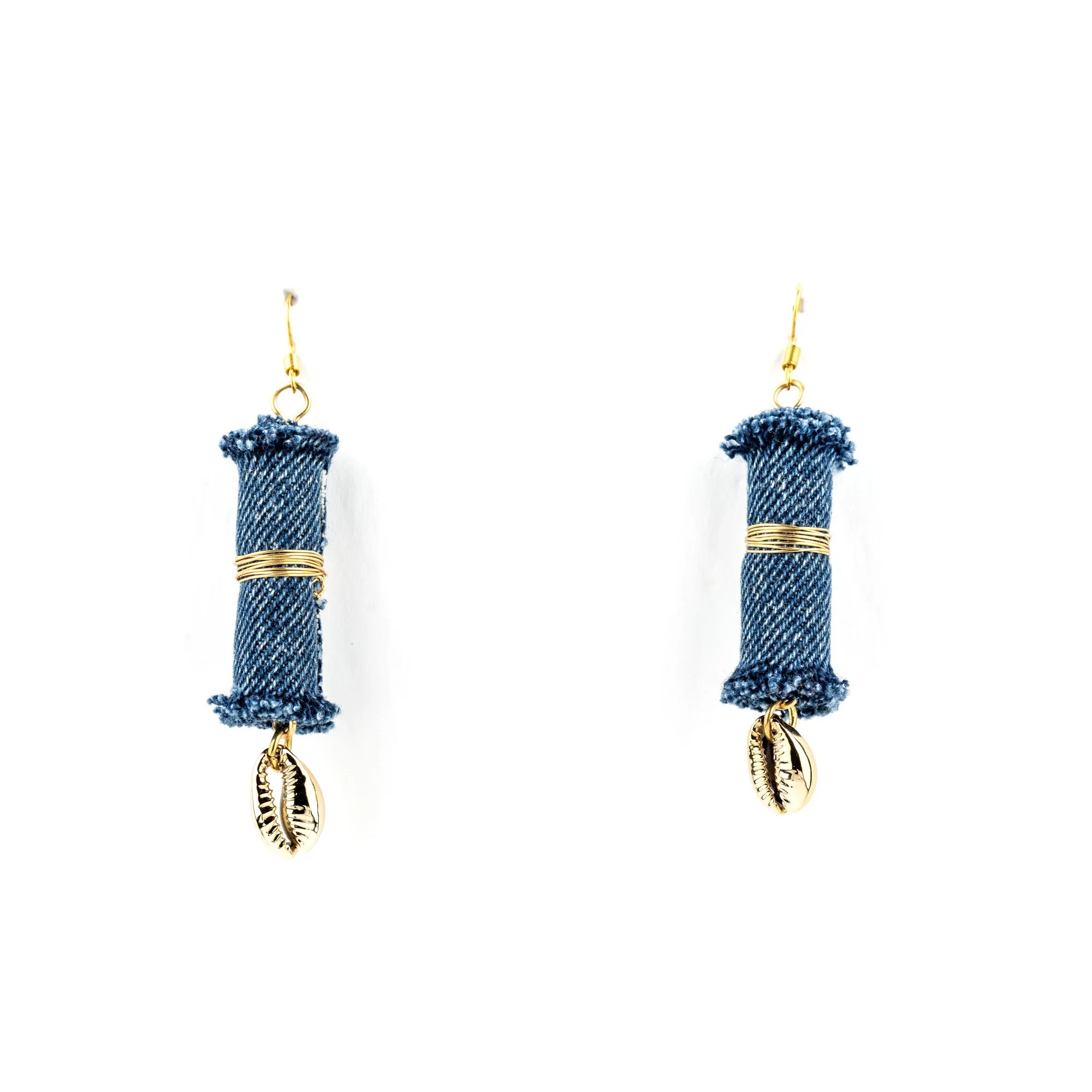 Pair of earrings with denim fabric wrapped around cylindrical shapes, gold wire wrapping, and small gold shell charms at the bottom.