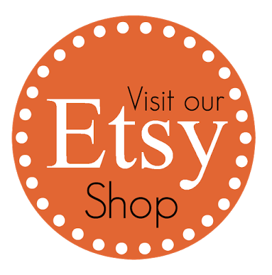 A circular badge with a burnt orange background and white dotted border. It reads "Visit our Etsy Shop" with "Etsy" prominently in large white font.