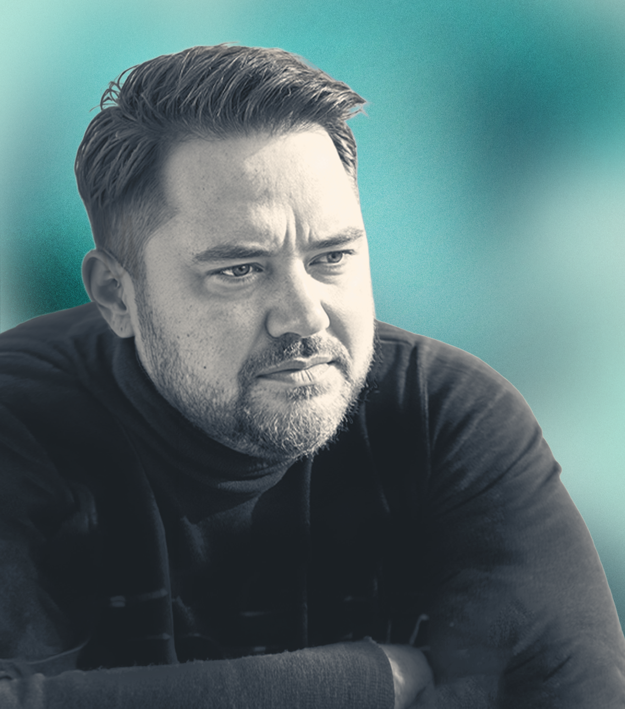 A black and white photo of a Nick Richtsmeier looking contemplative against a teal background.