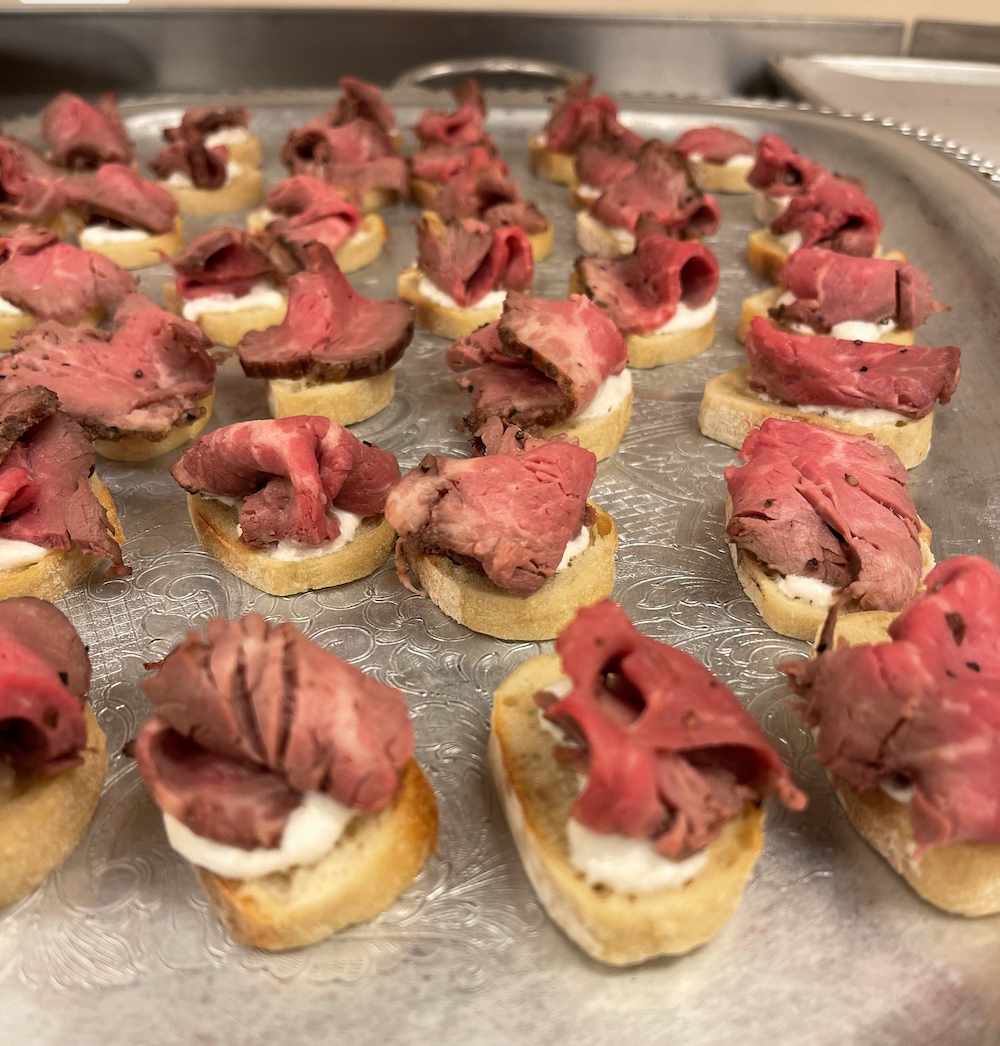 Mini toast with whipped horseradish sauce and sliced tenderloin