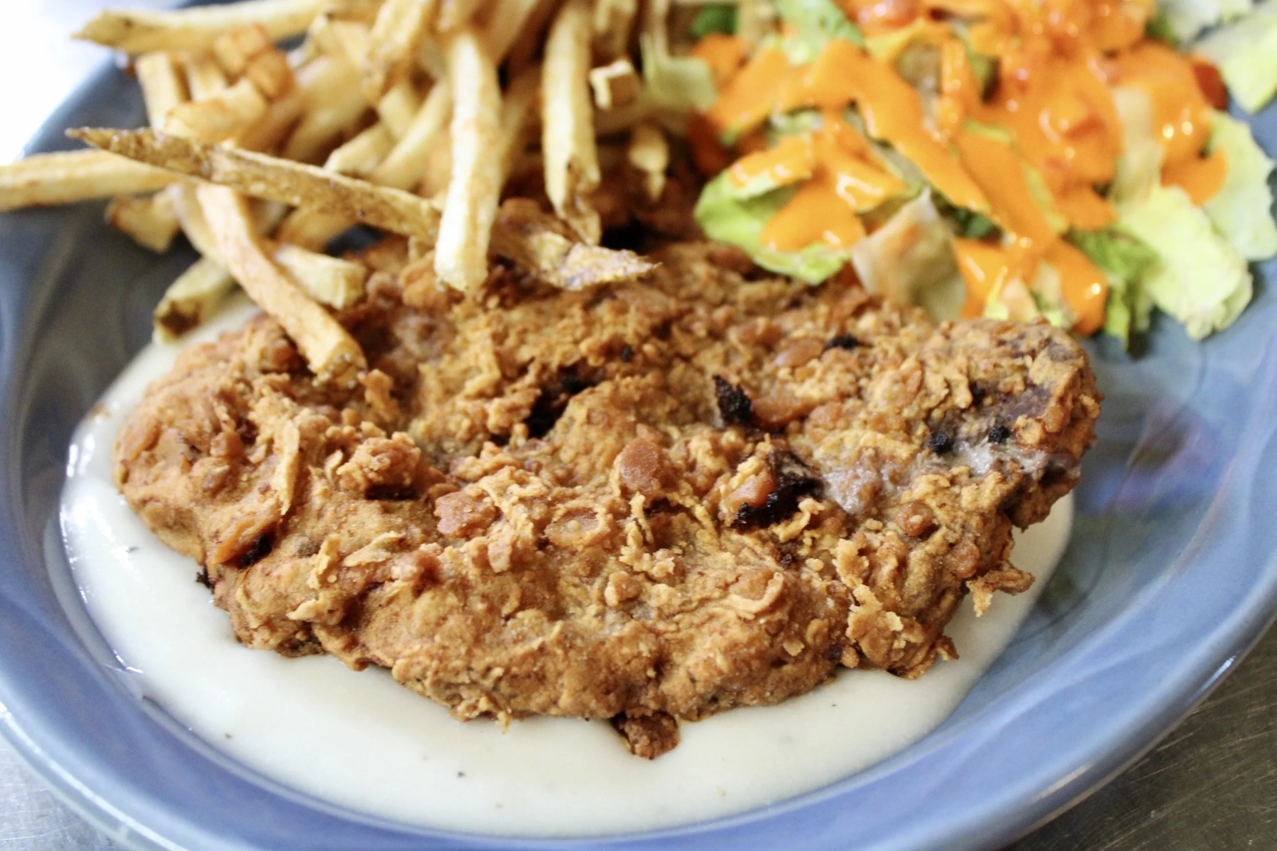 Chicken Fried Steak with hand-cut fries and fresh salad
