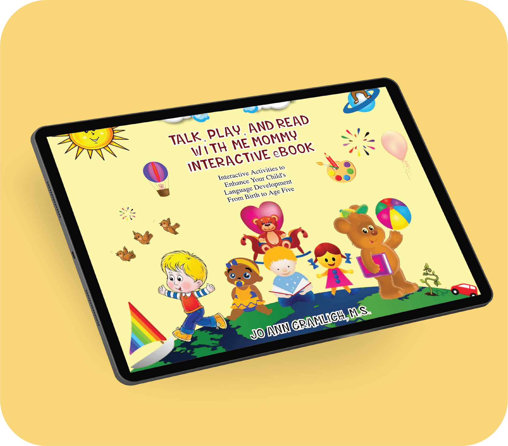 A tablet displays a colorful children's interactive eBook cover titled 'Talk, Play, and Read with Me Mommy' by Jo Ann Gramlih, M.S., featuring cartoon children and animals, including a bear, a girl, a boy, and a monkey, with bright illustrations of a sun, rainbow, balloon, and toys.