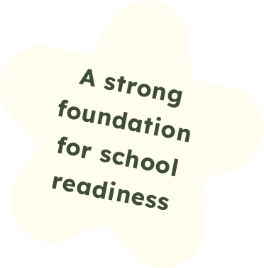 A star-shaped sign with the text 'A strong foundation for school readiness' written on it.