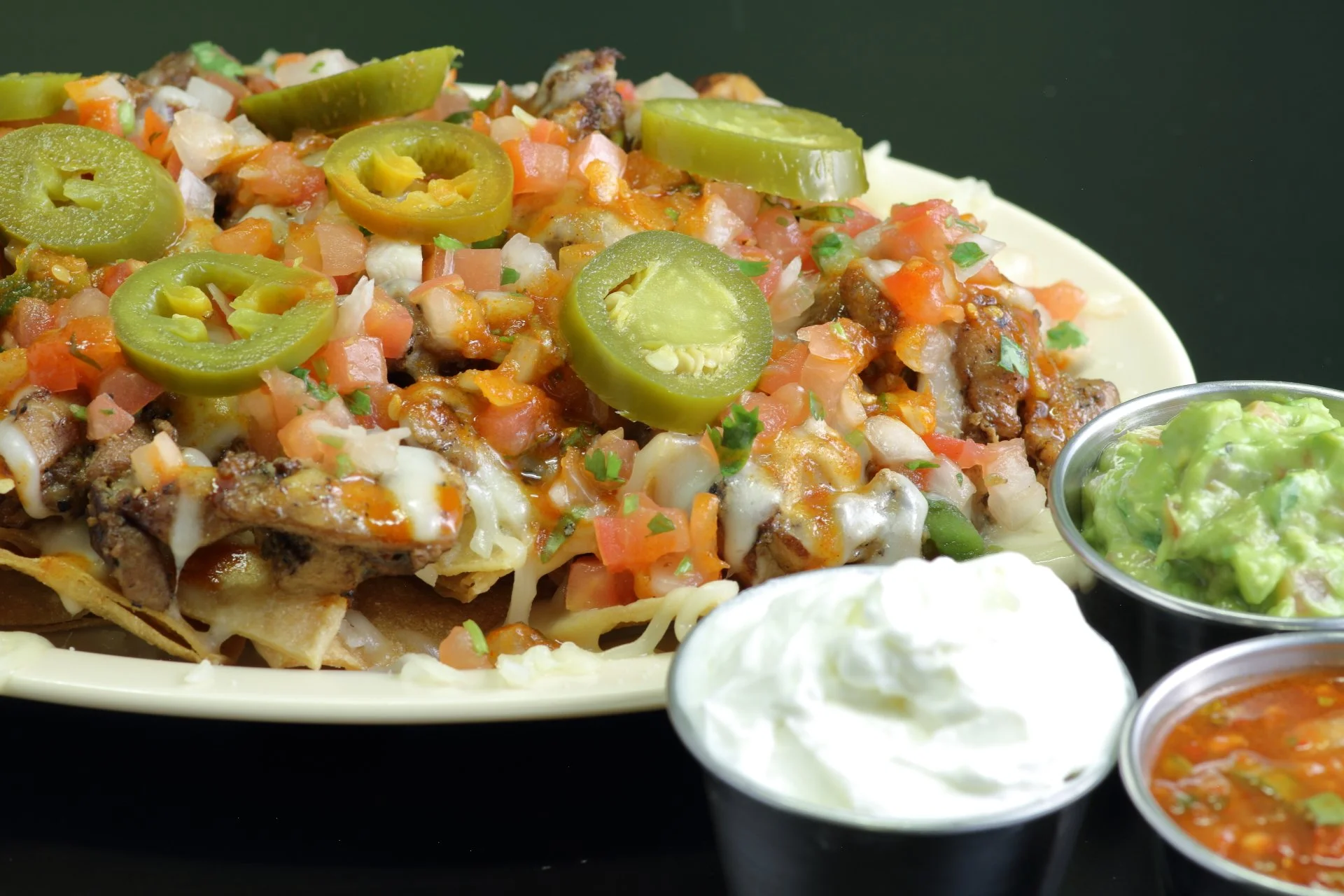 Fusion Chicken Nachos with Guacamole and Sour Cream