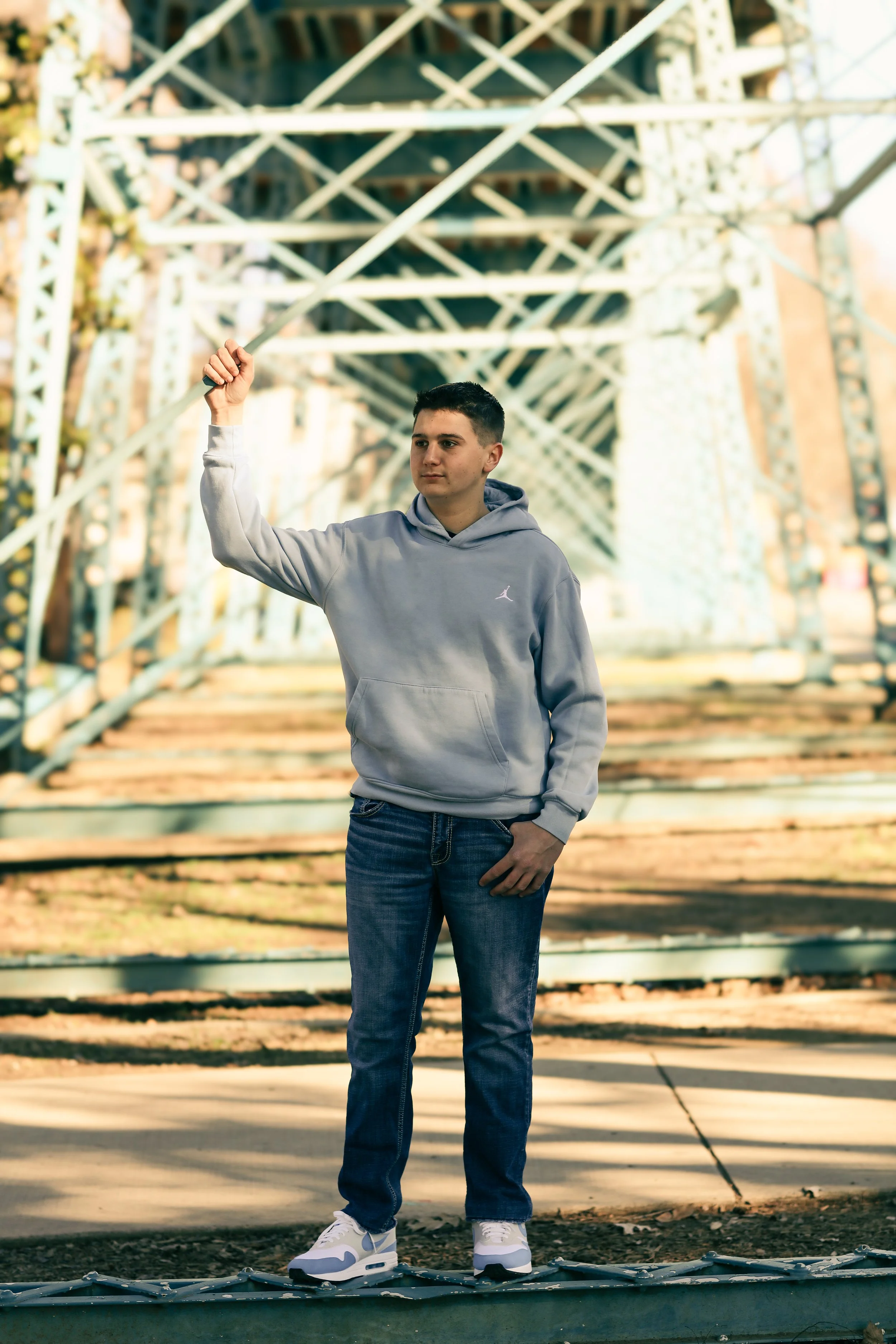 Male Senior photo downtown Chattanooga,TN, blue bridge 