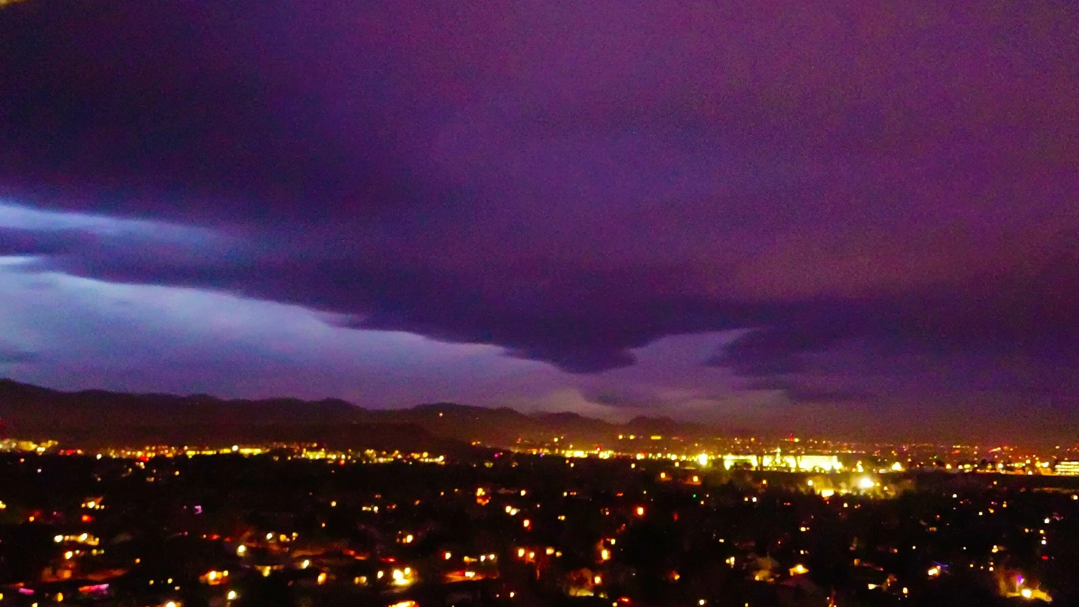 OK I know it's been a few days, I have been busy with life. But here was my attempt at taking a picture of the Auroras on Wednesday night. As you can tell...there were way too many clouds! But I got some cool colors. These were taken from my patio at