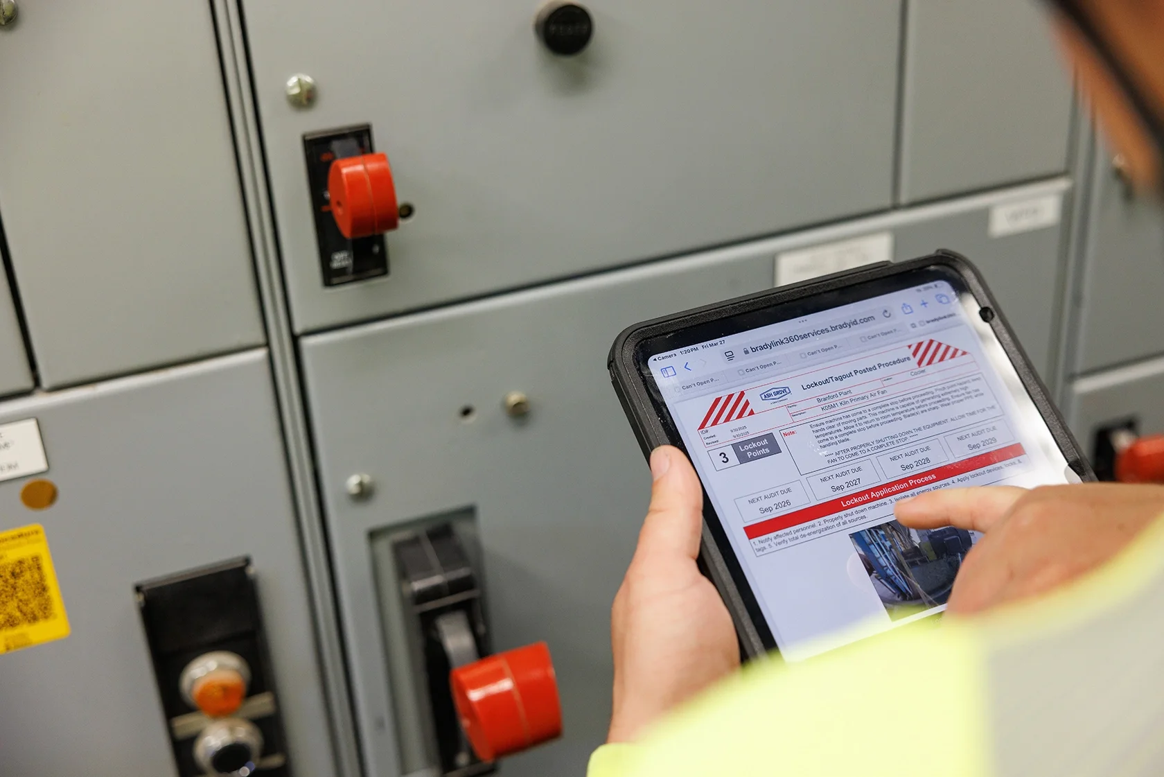 Using an application on a tablet to make routine safety check on a panel
