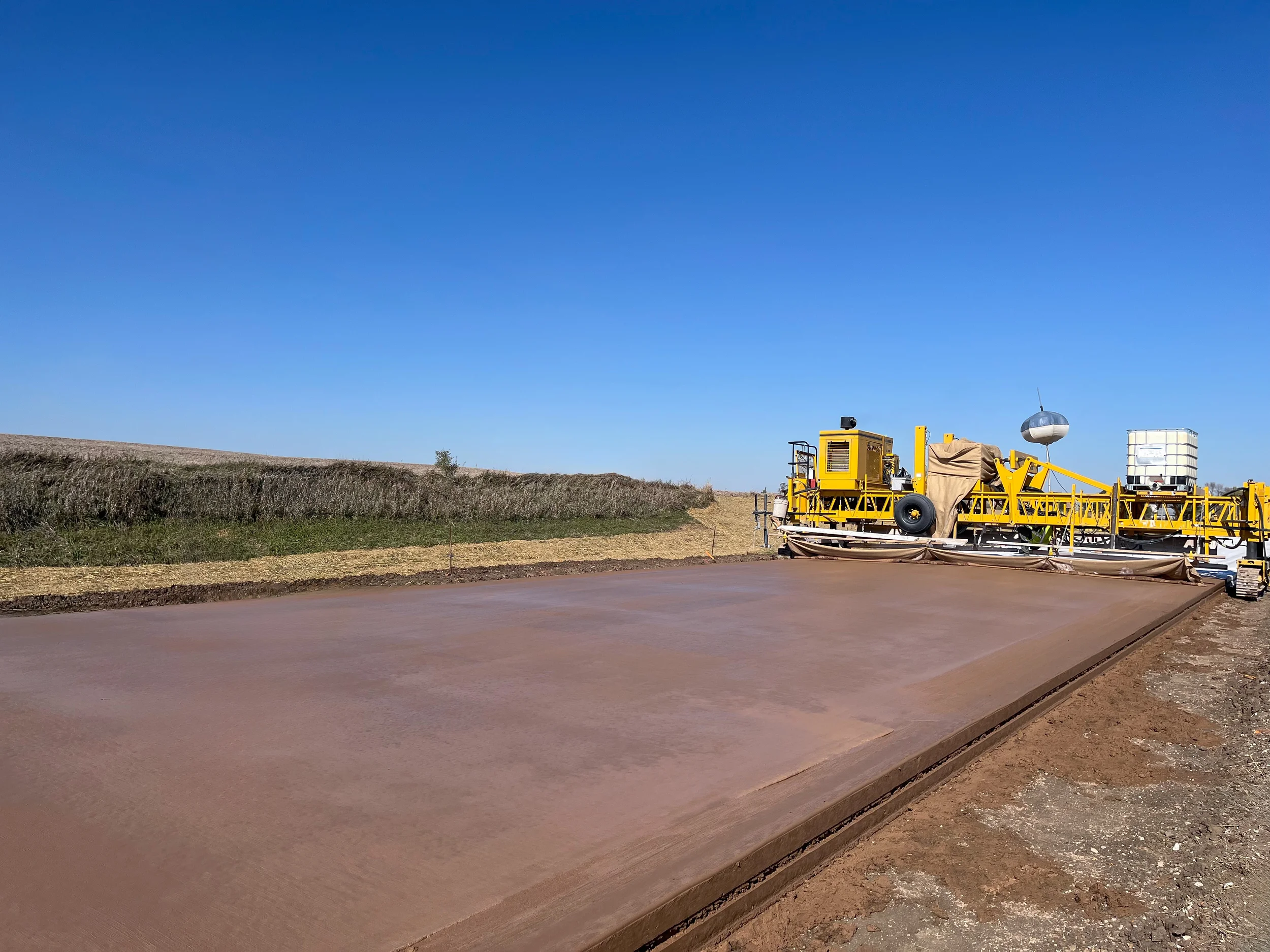 Heavy construction paving a road with our products