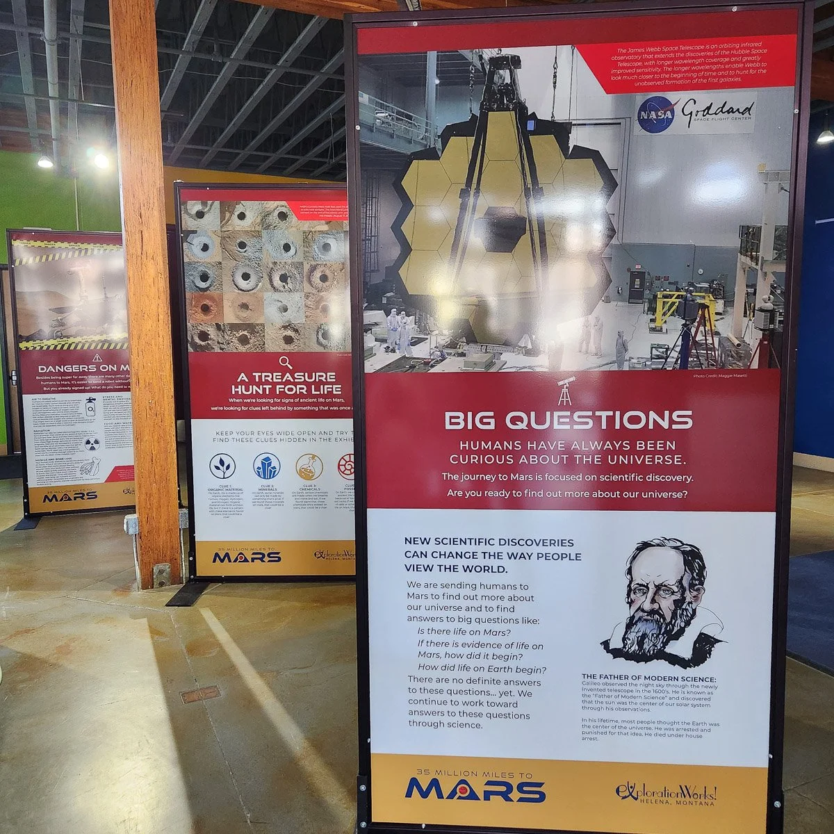 Custom large format signs for Exploration Works in Helena, MT. The signs are about Mars exploration and scientific discovery, featuring images of space equipment and information for visitors.