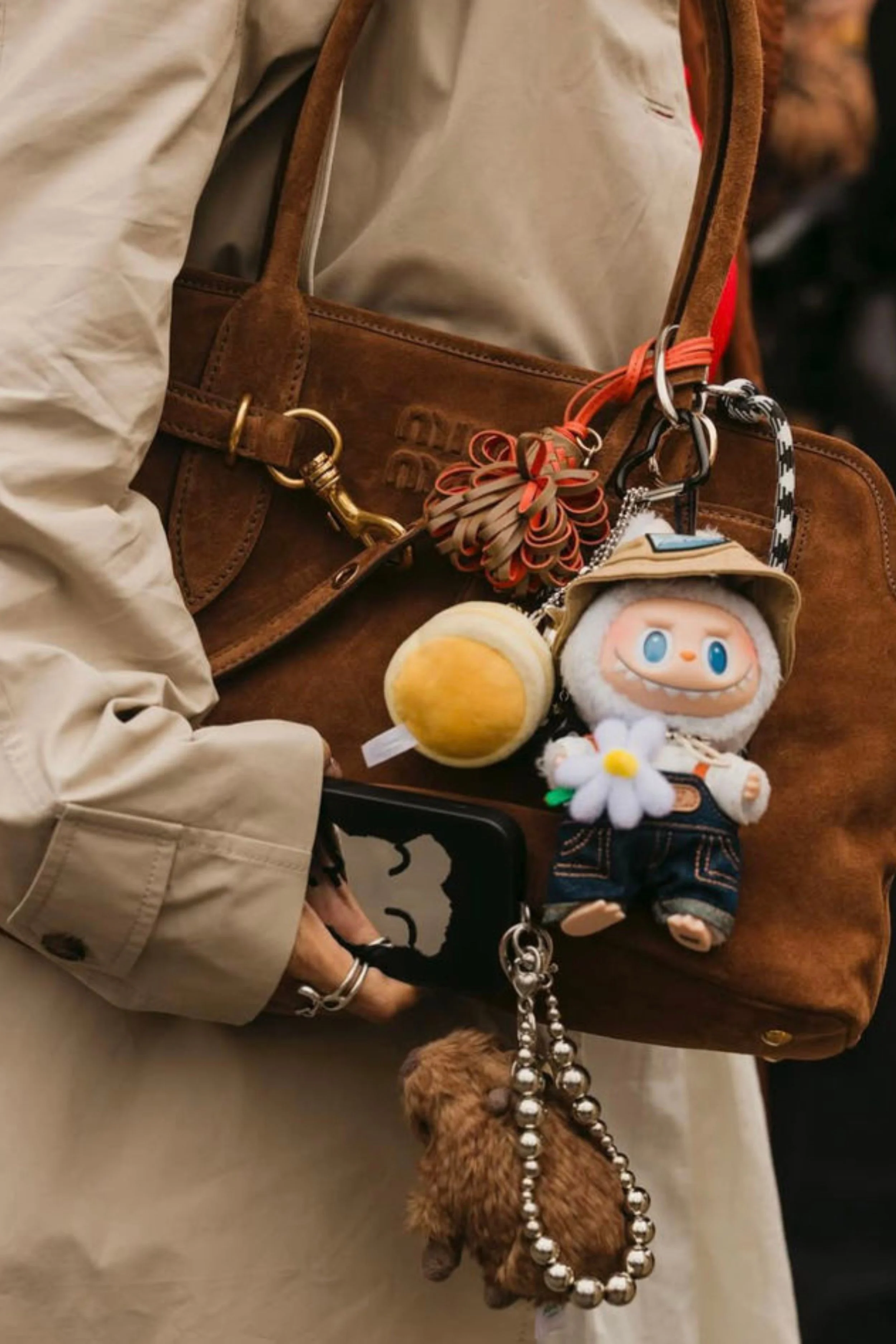 collectible-bag-charms-on-leather-shoulder-bag.jpg
