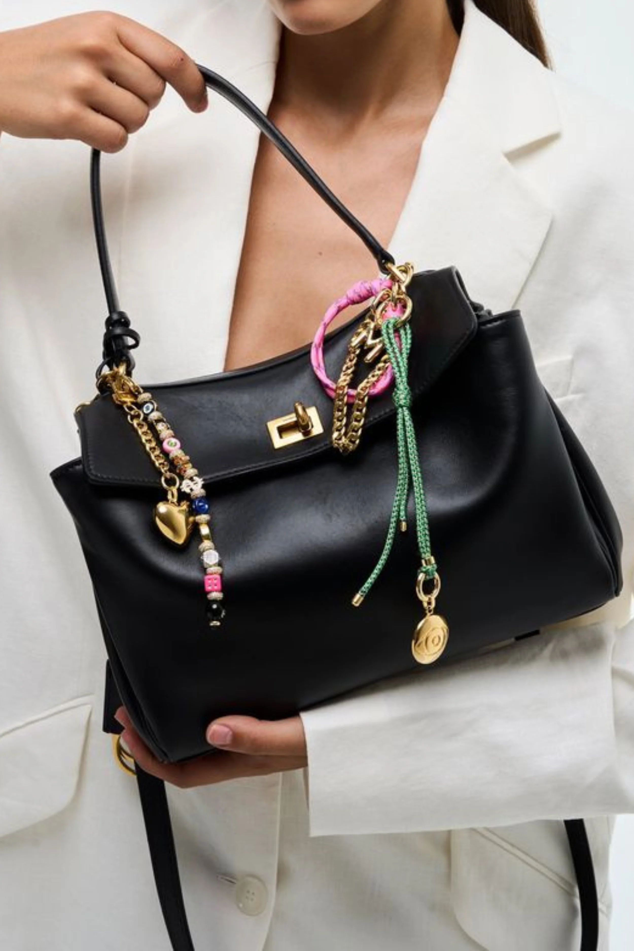 minimal-black-shoulder-bag-with-charms.jpg