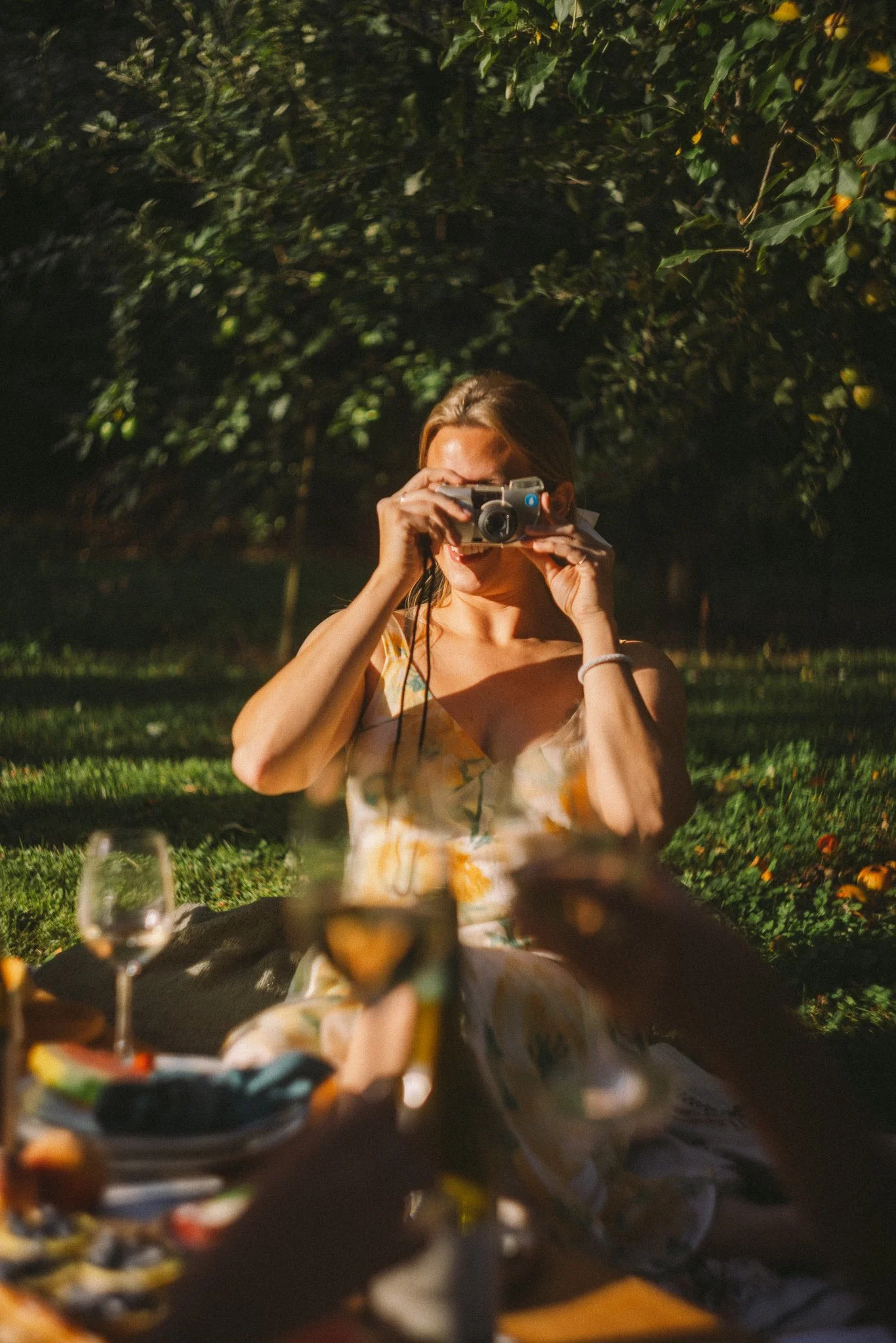 girl having fun with film camera