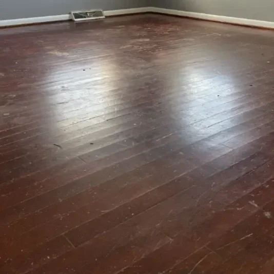 Empty room with wooden flooring. 