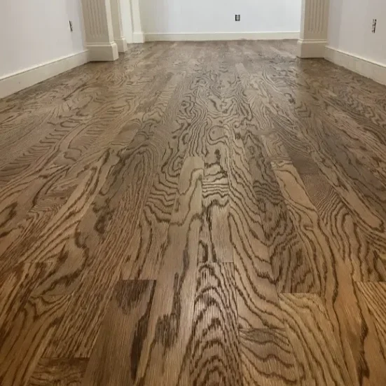 Close-up view of a hardwood floor with visible wood grain patterns.